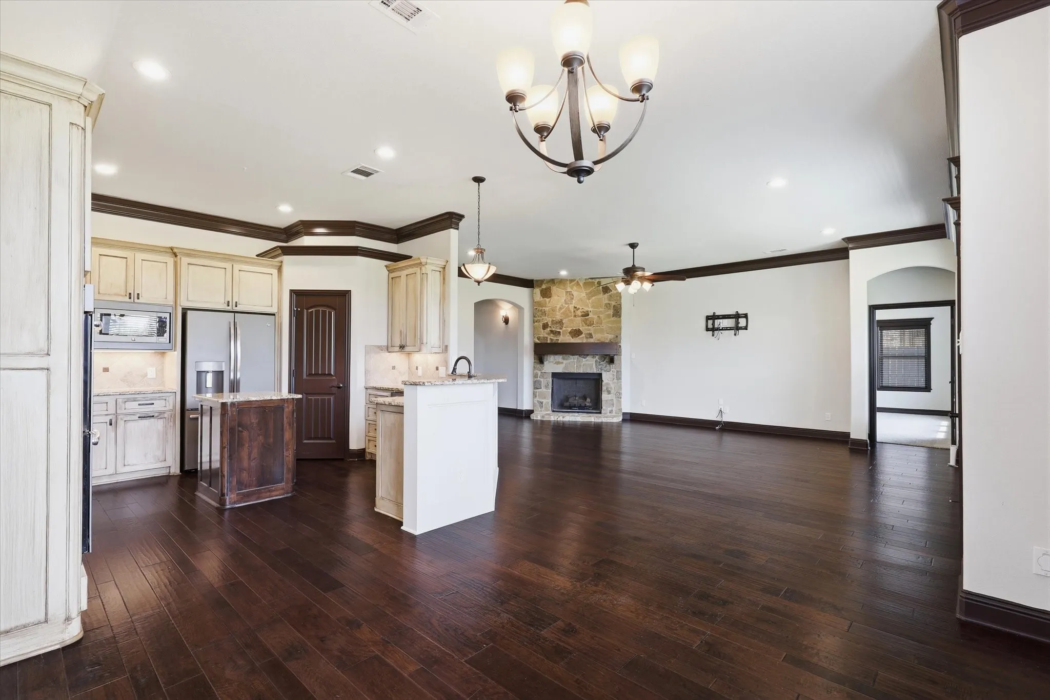 Varying cabinet heights and oversized crown molding create a furniture-quality appearance.