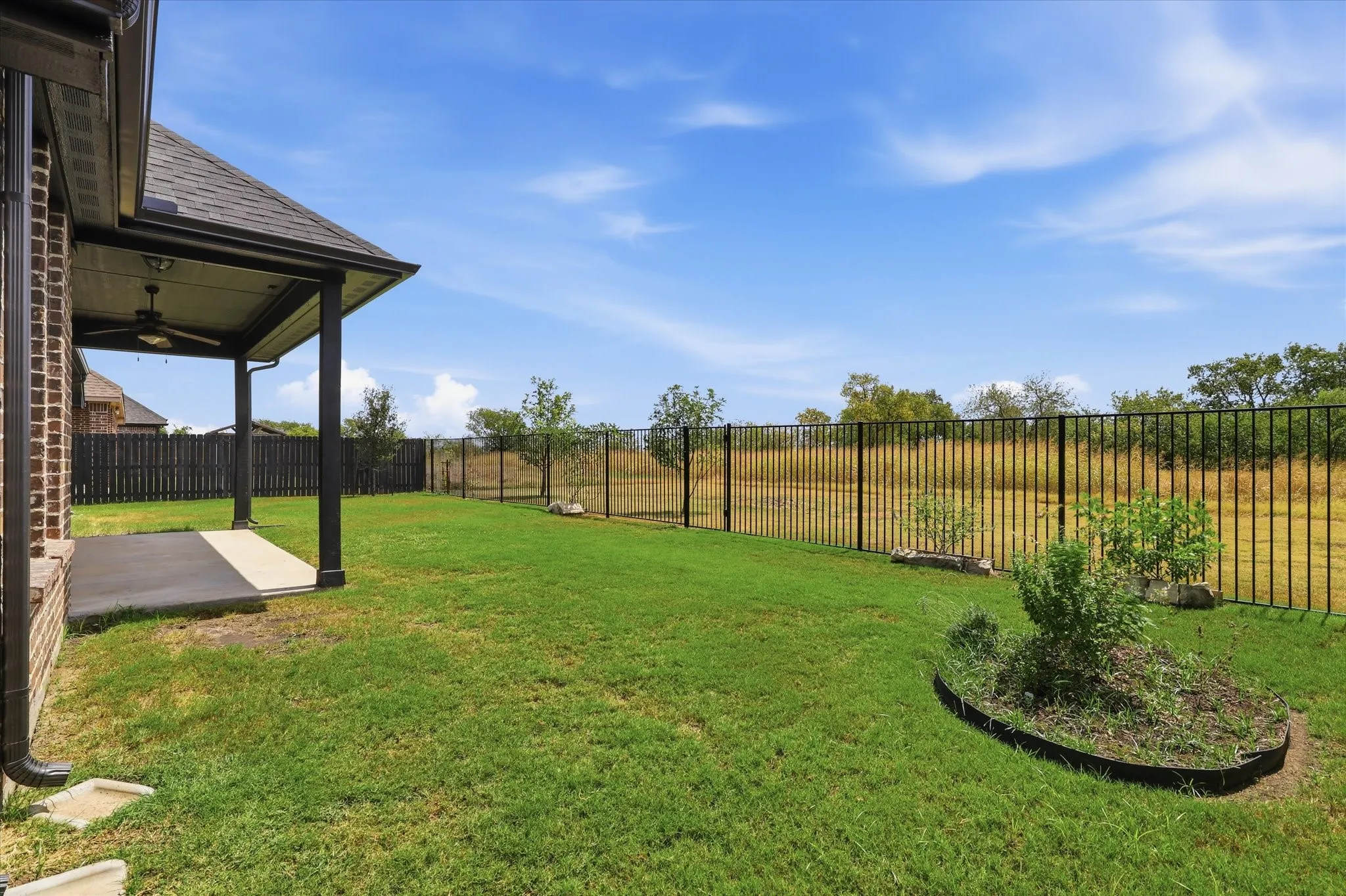 Open views beyond the rear wrought-iron fence!