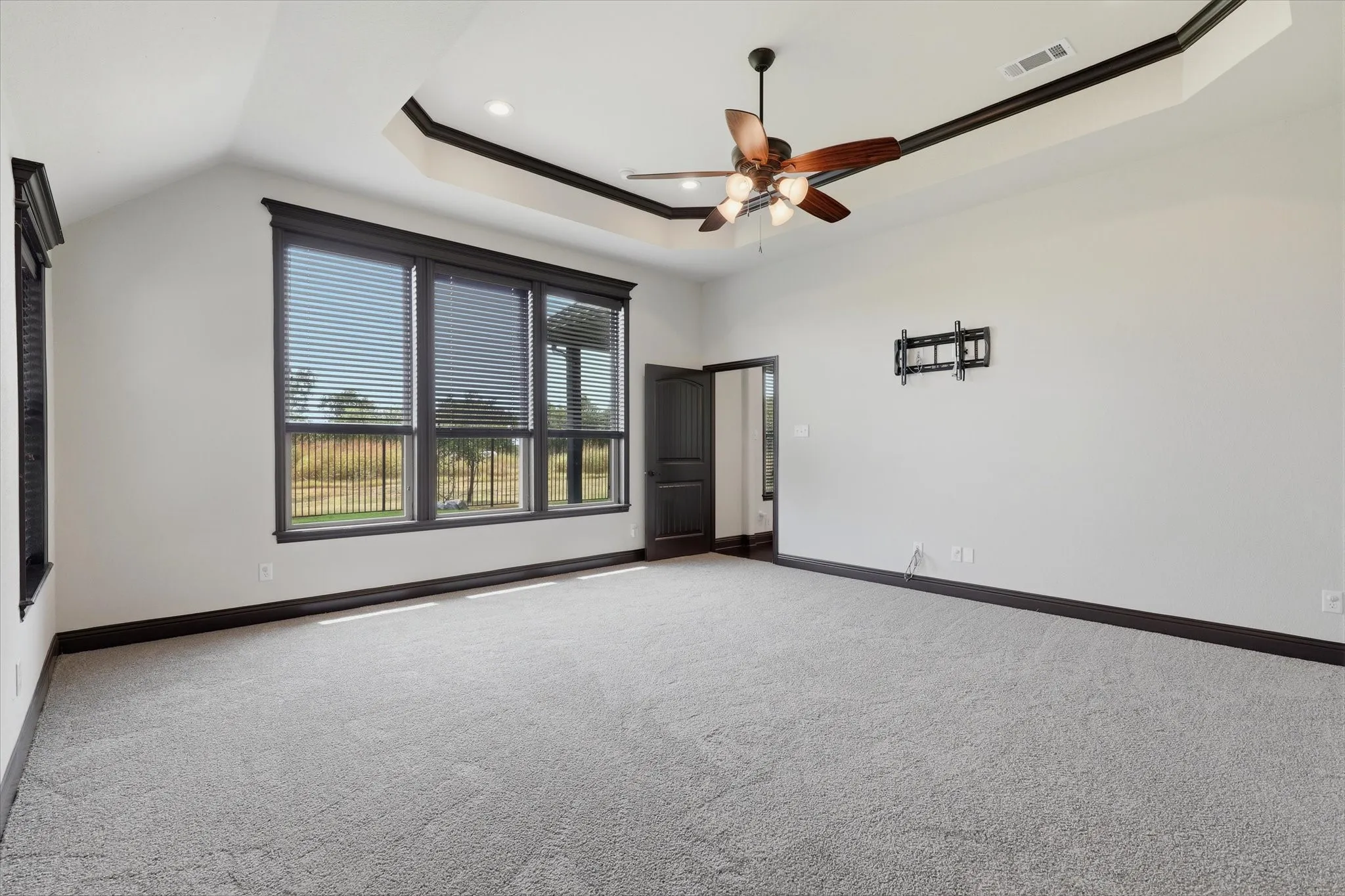 Additional windows, substantial window casings and oversized baseboards continue the detailed millwork found throughout this home.