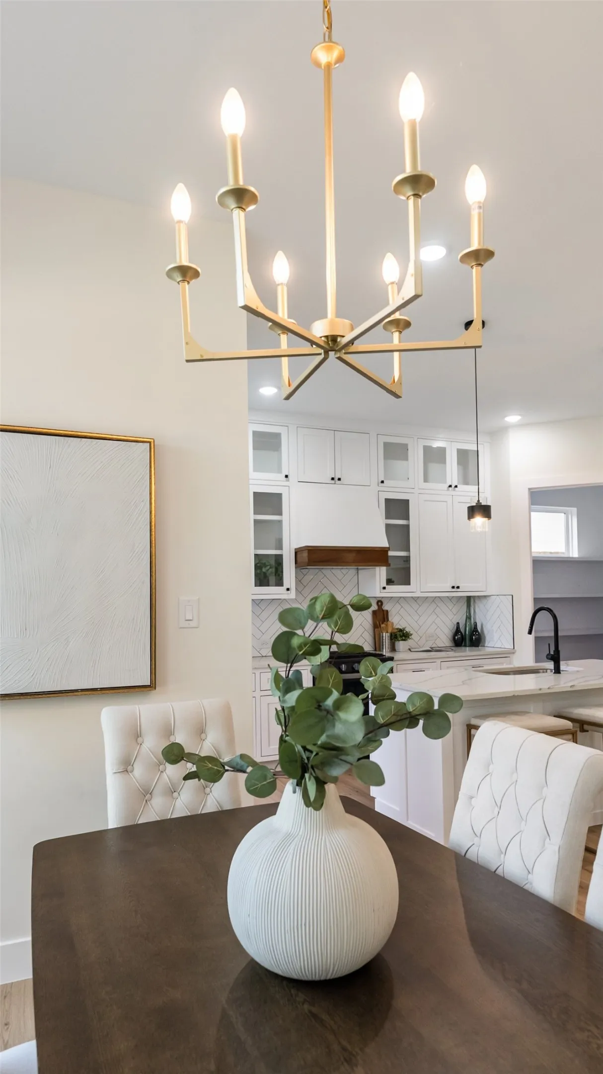 Gold-finish chandelier with multiple candle-style lights