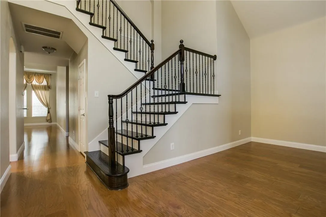 Staircase with wood-type flooring