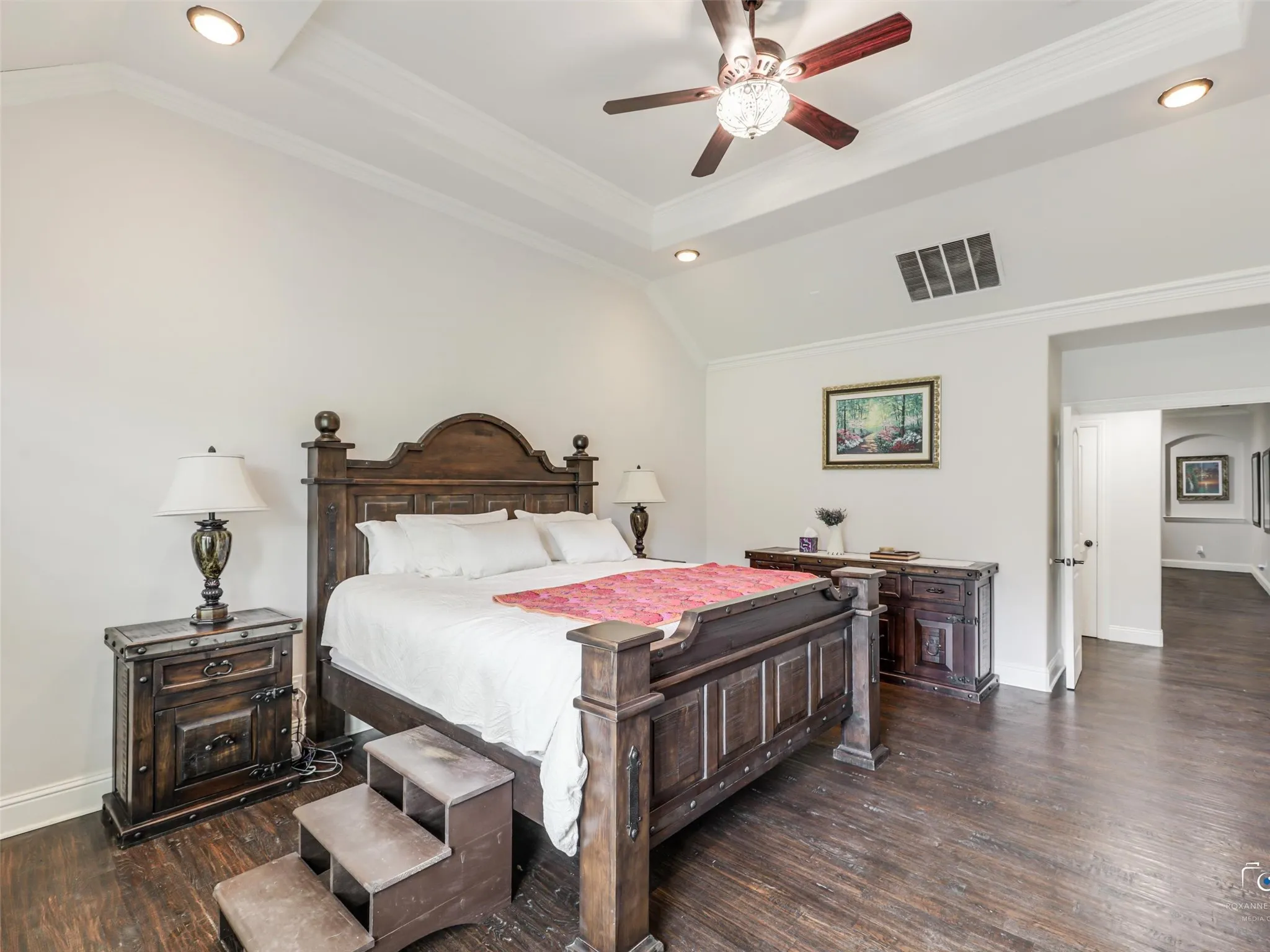 Tray ceiling with recessed lighting and crown molding