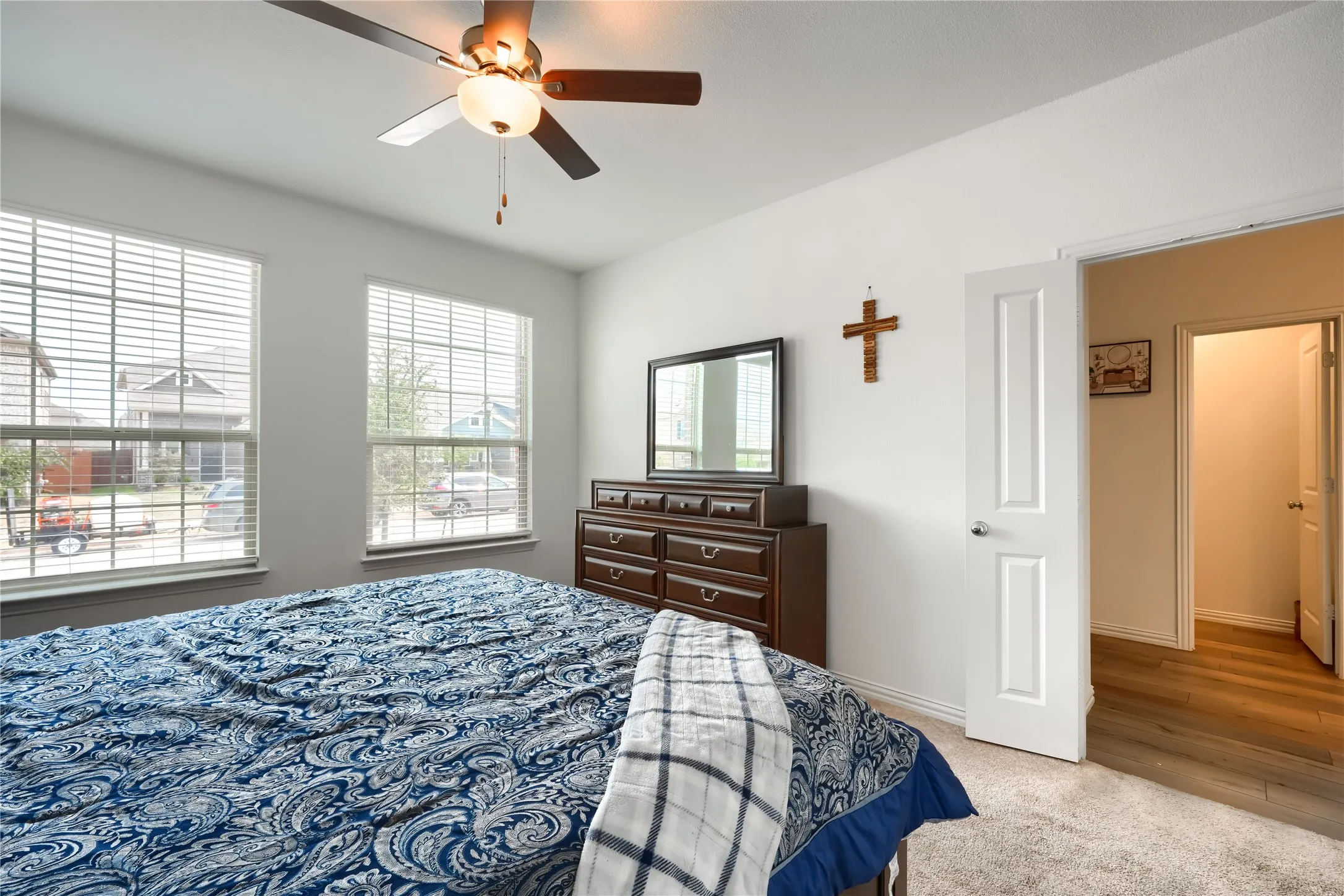 White interior walls with neutral carpeting