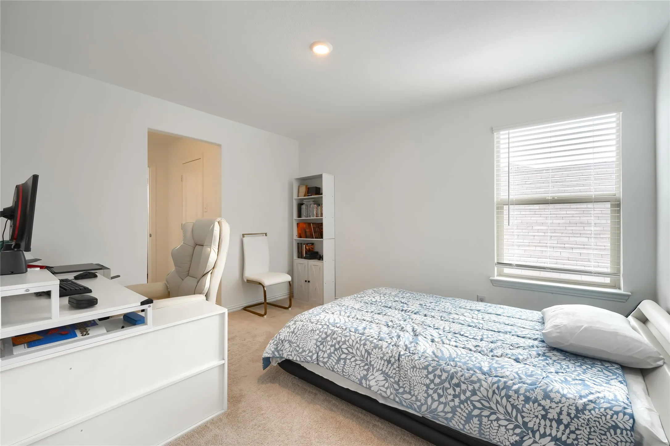 Recessed ceiling lighting, wall-to-wall carpeting, window with blinds, and white painted walls