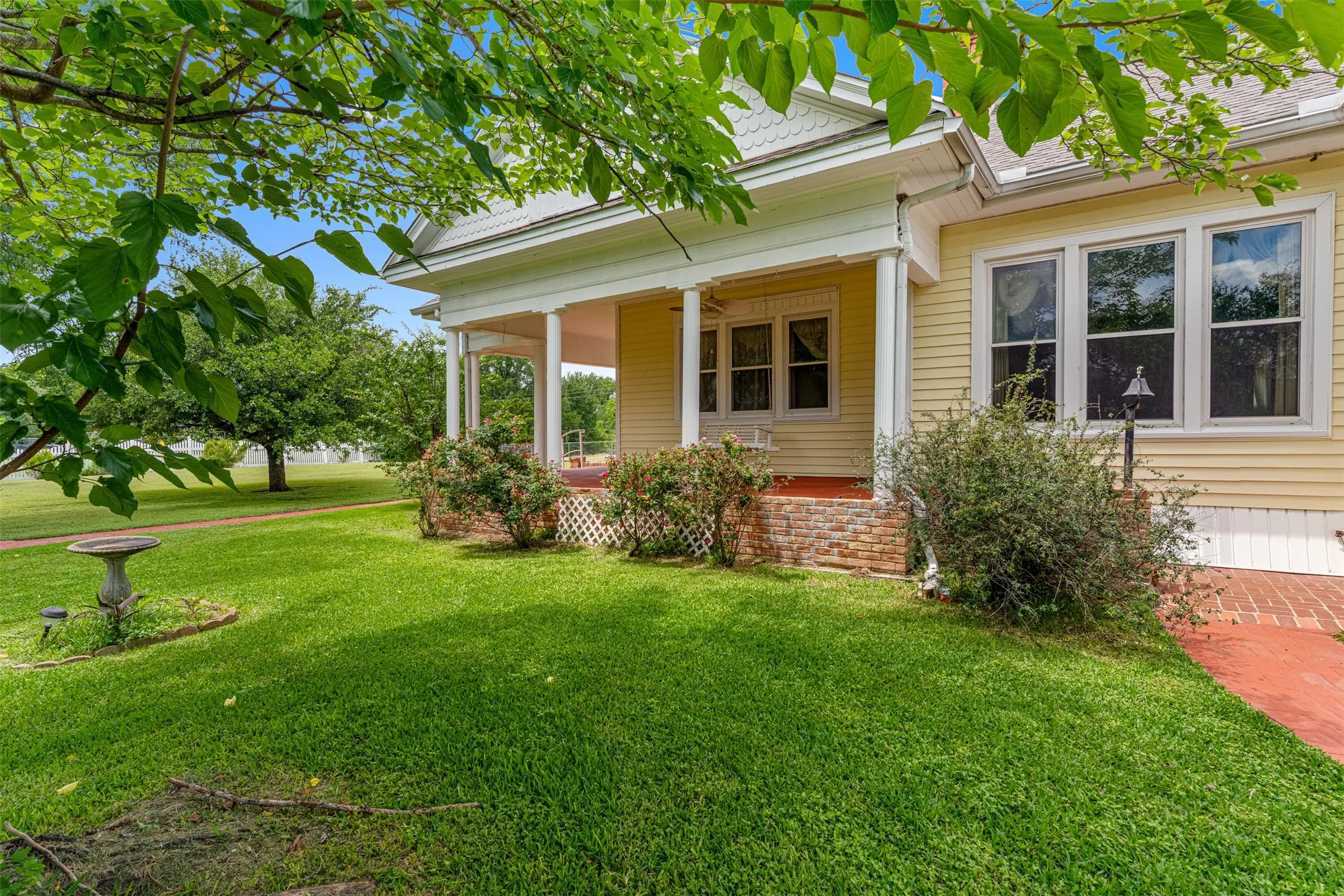 Serene setting of the home with large trees