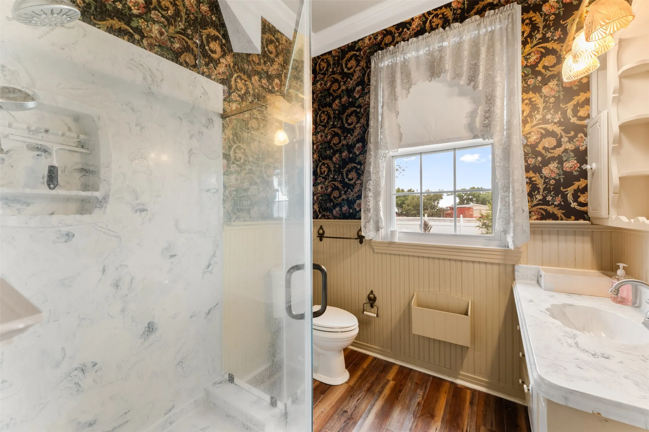 En-suite bath area, large shower, beadboard paneling