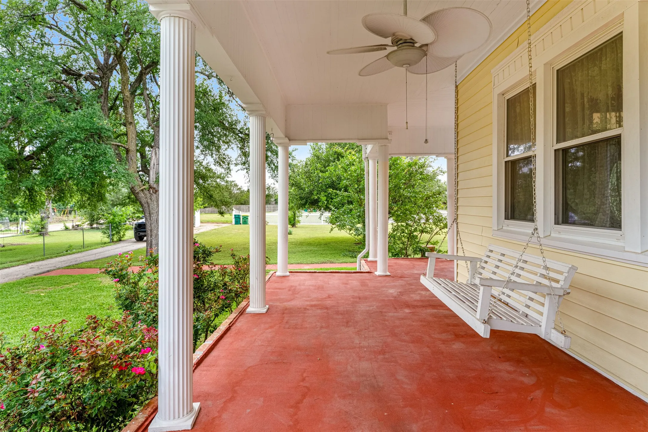 Enjoy your morning coffee or just listing to the birds on the porch swing. Wraparound porch with white columns with another entrance into the family room