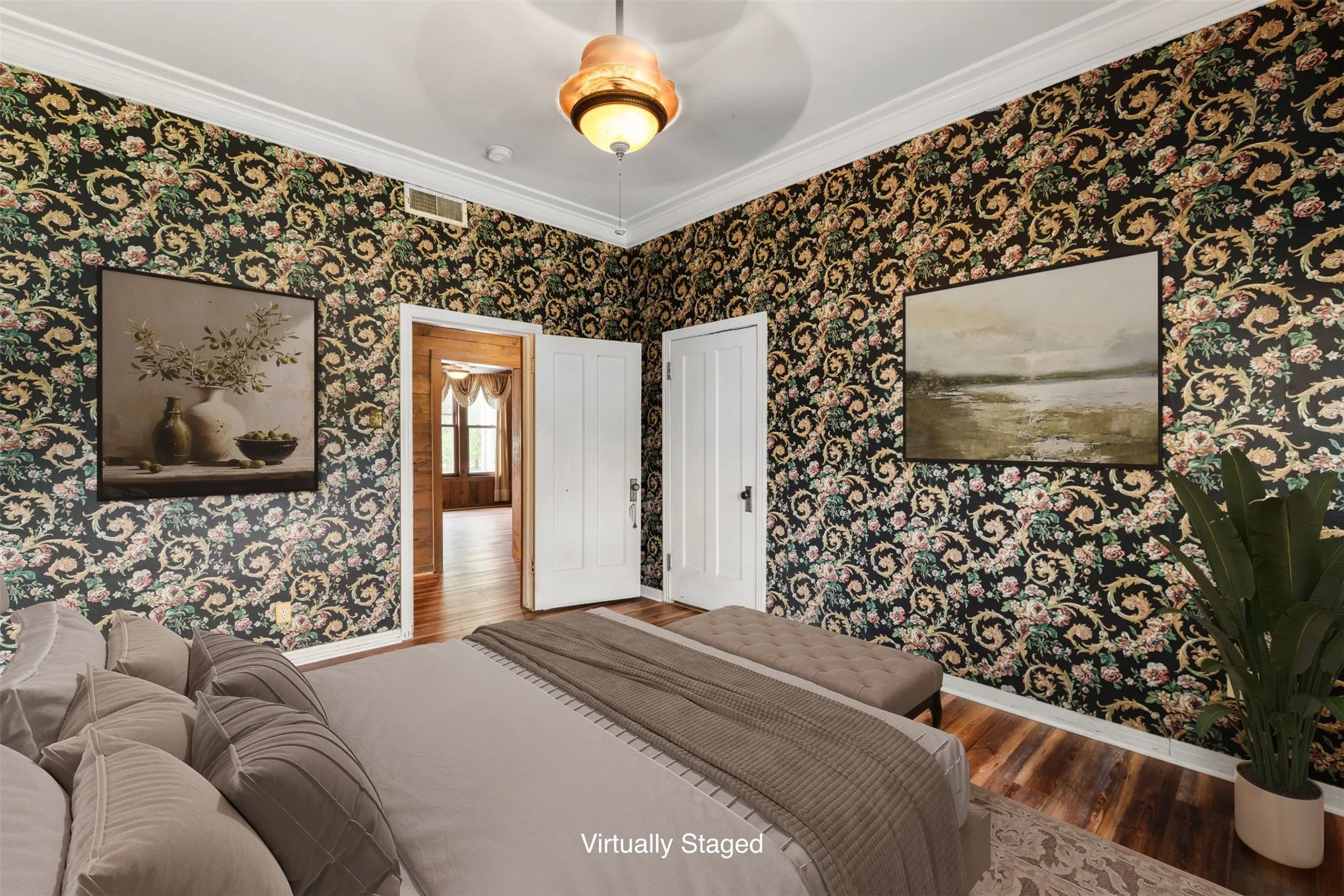 Large Owner's Suite with beautiful crown molding and timeless wallpaper (Virtually Staged)