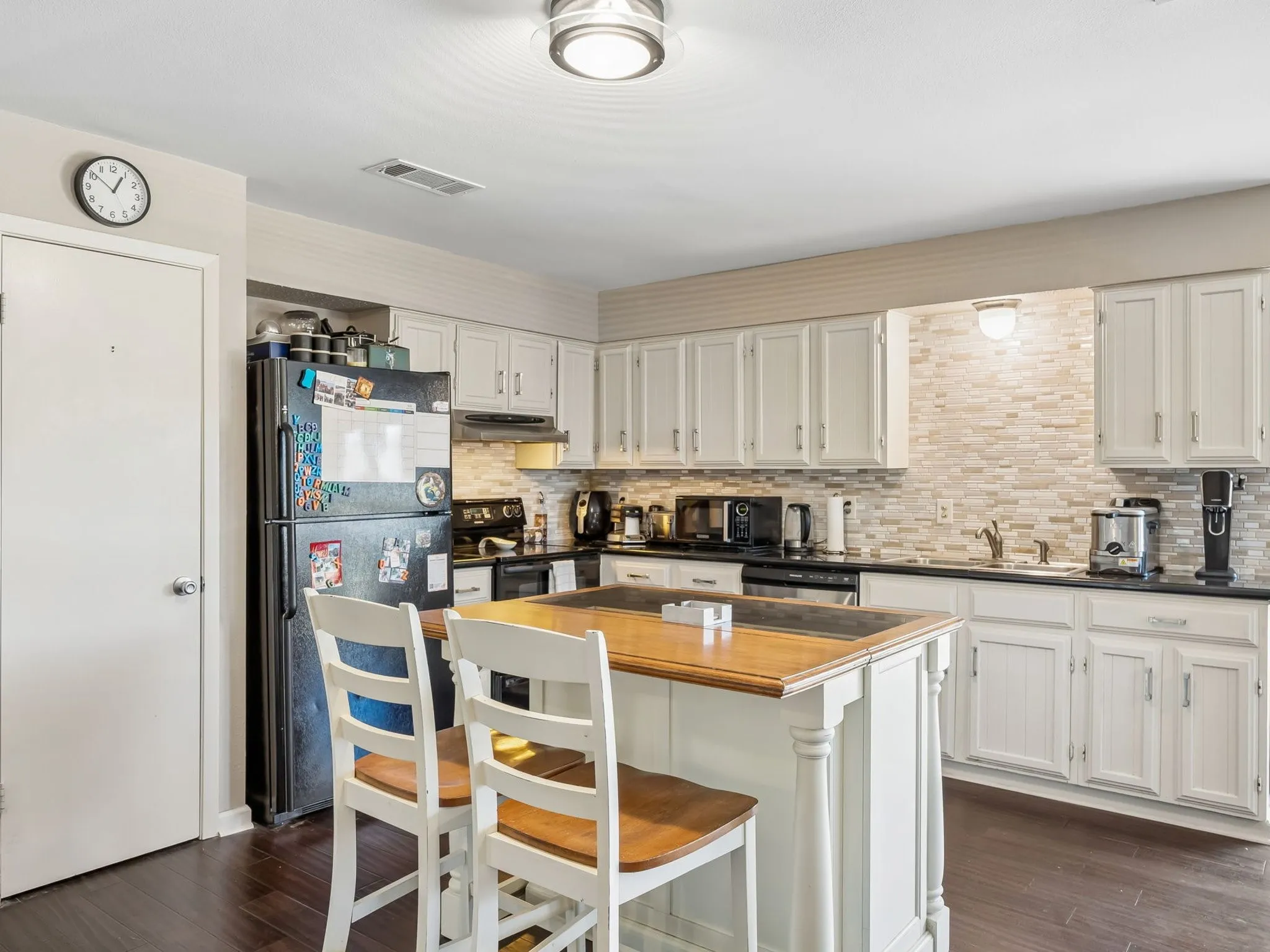 breakfast bar kitchen island makes friend gathering while cooking easy!