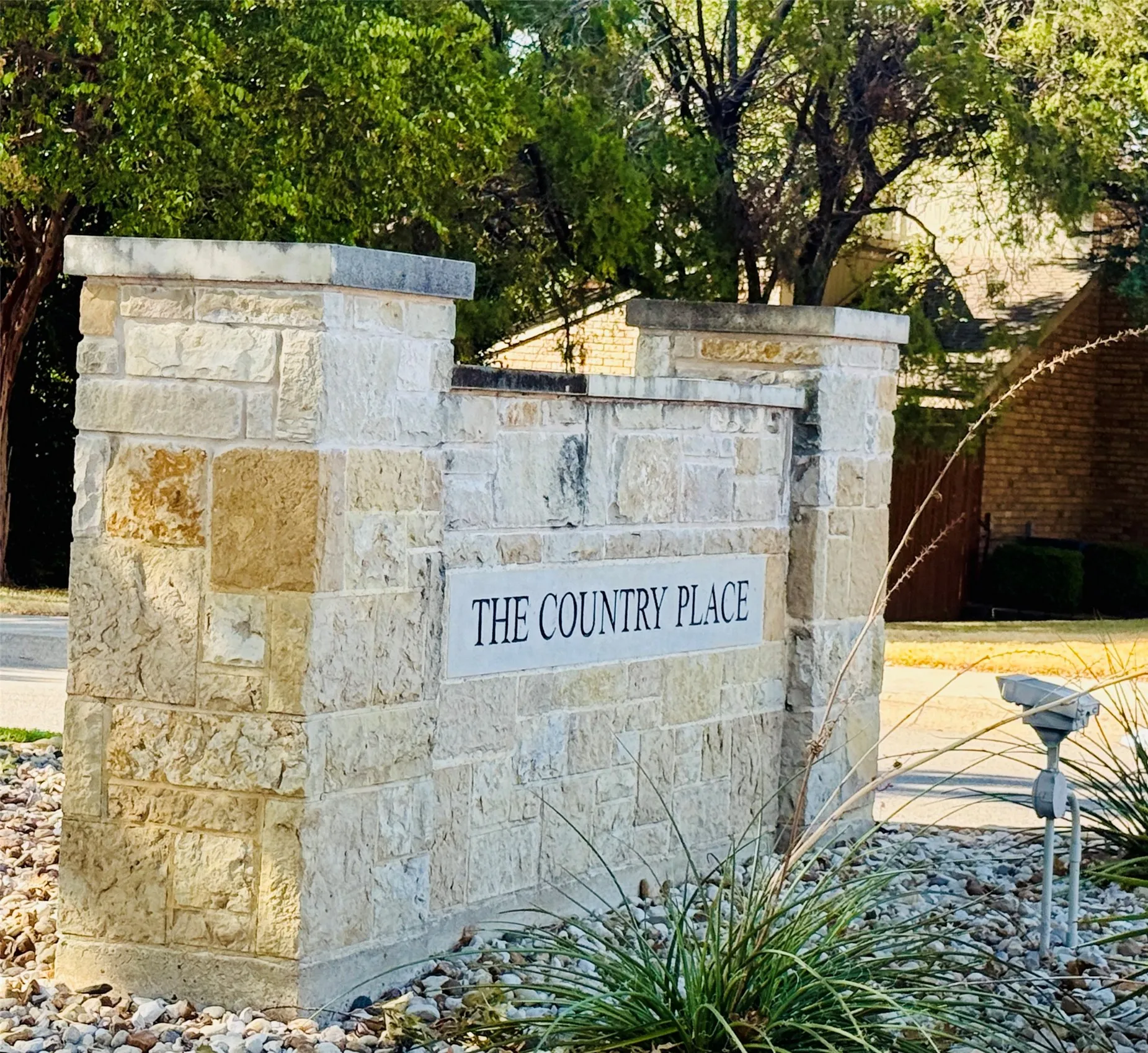 Stone masonry entrance monument for "The Country Place."
