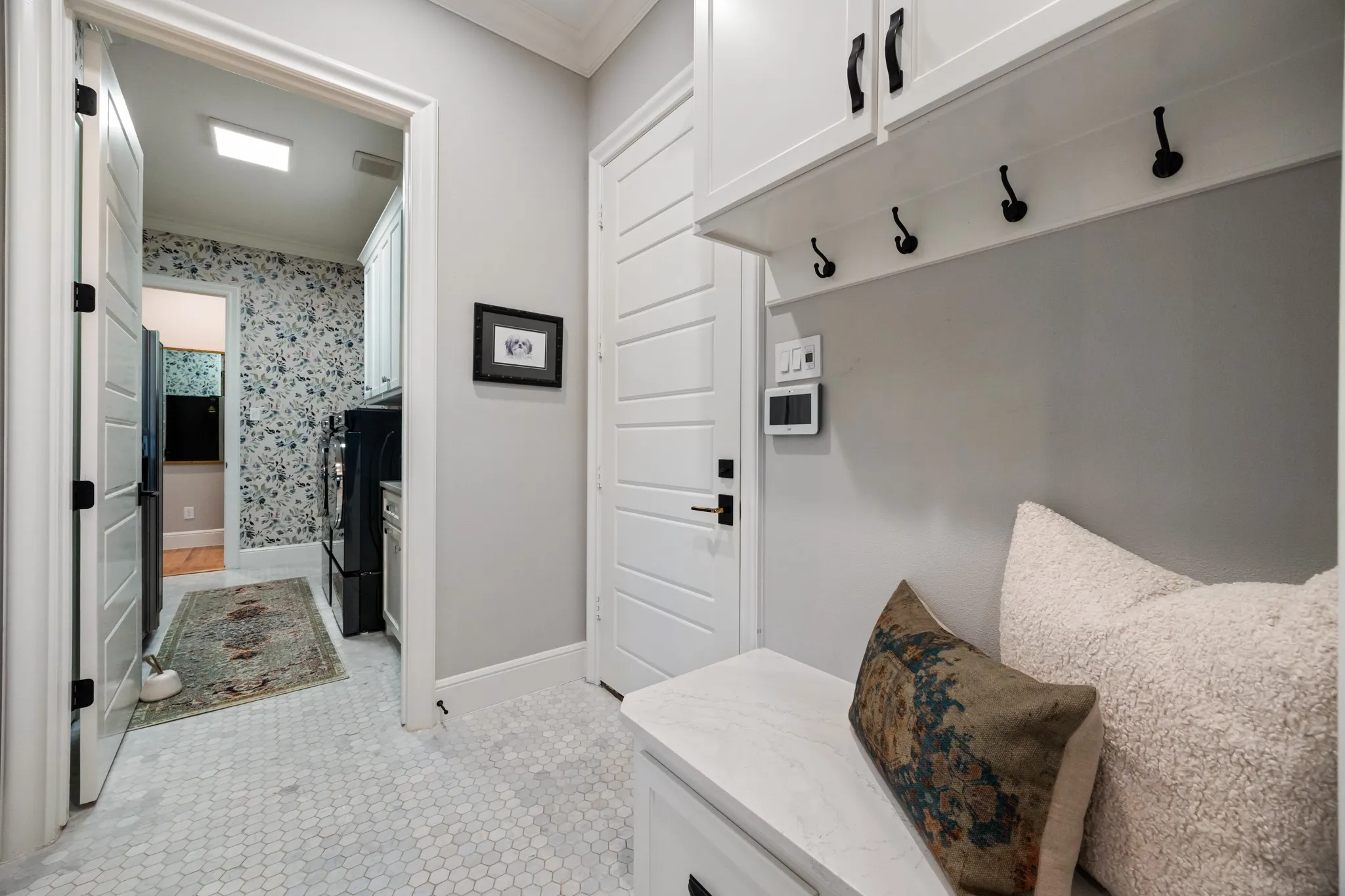 Built-in mud room bench and storage keep everyday drop-offs organized.