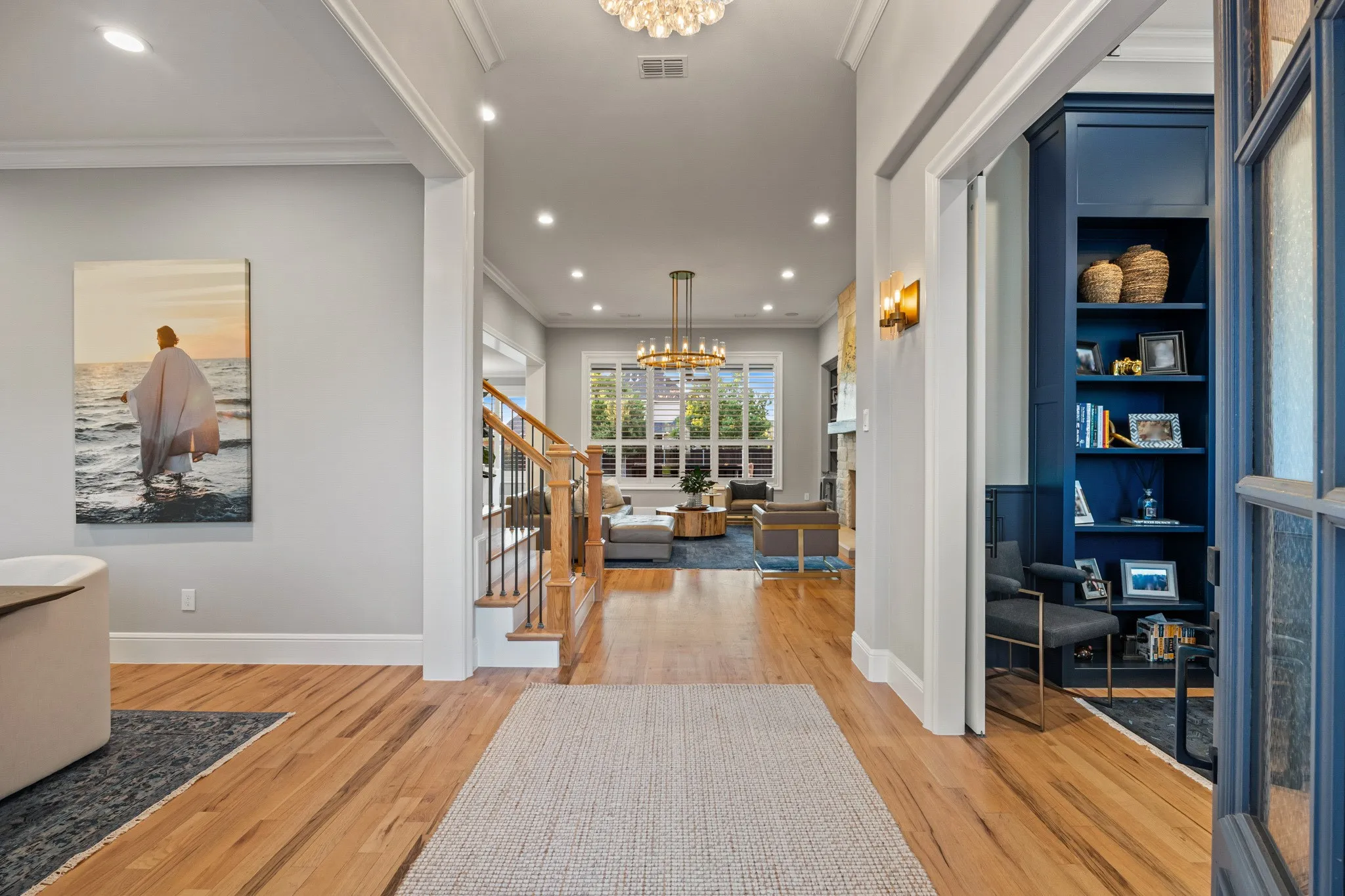 Foyer sightline stretches past the private office straight through to the sun-filled living room.