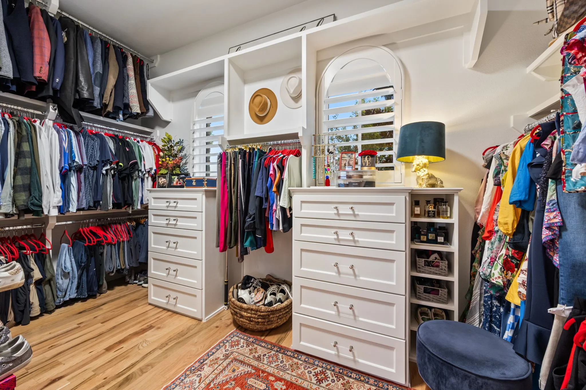 Primary closet built out with custom shelving, ready to organize a full wardrobe.