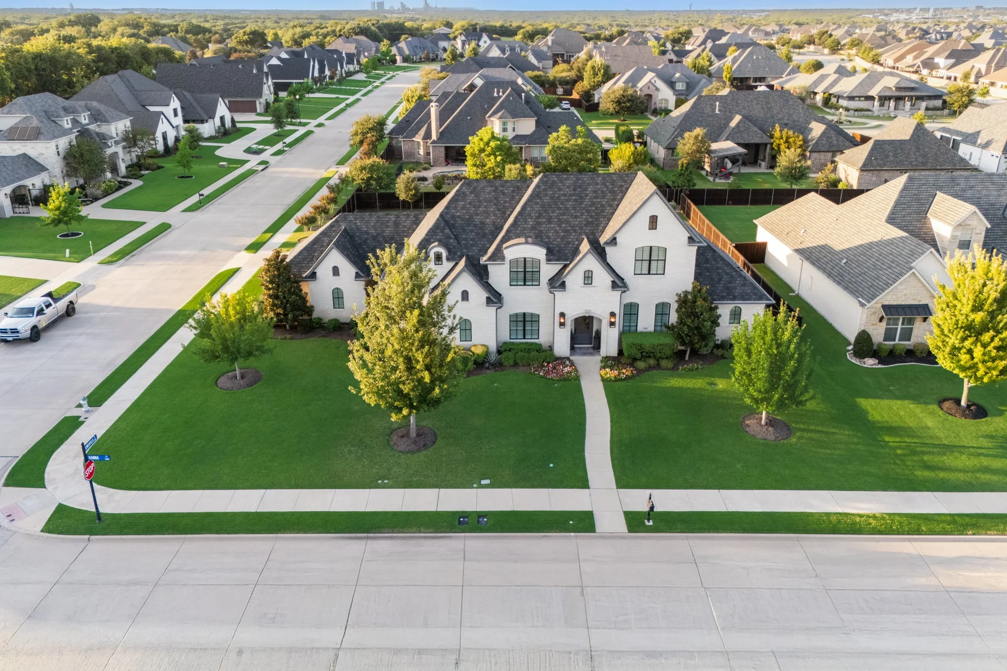 Aerial perspective shows the home's prime corner lot placement on a quiet street in Somercrest.