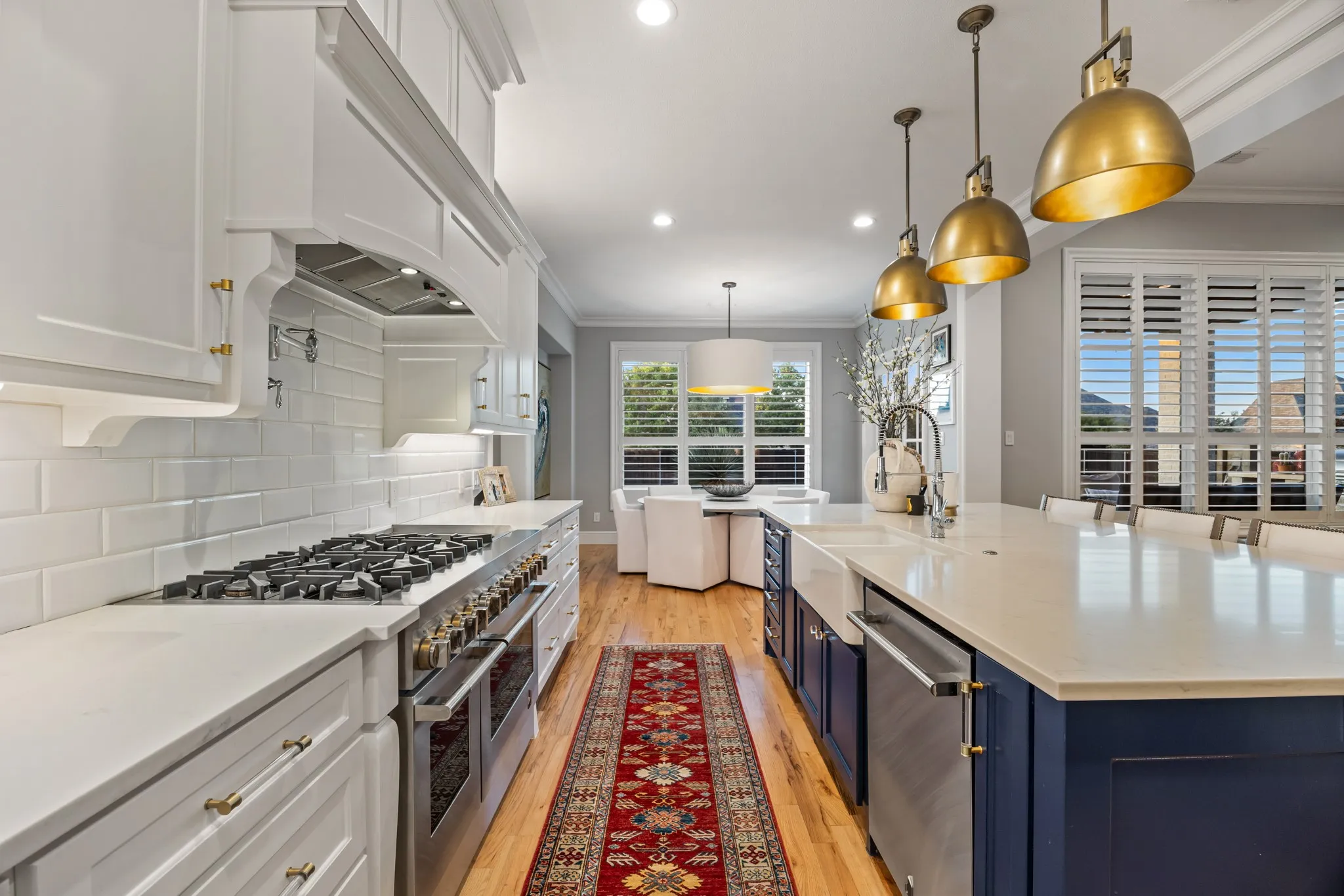 Island seating and a farmhouse sink make this kitchen as functional as it is beautiful.