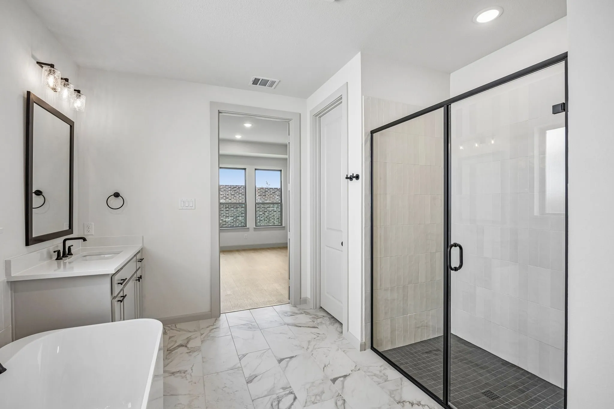 Whether it's soaking you cares away in the beautiful tub or indulging in a long luxurious shower...this owner's bath is a dream come true!