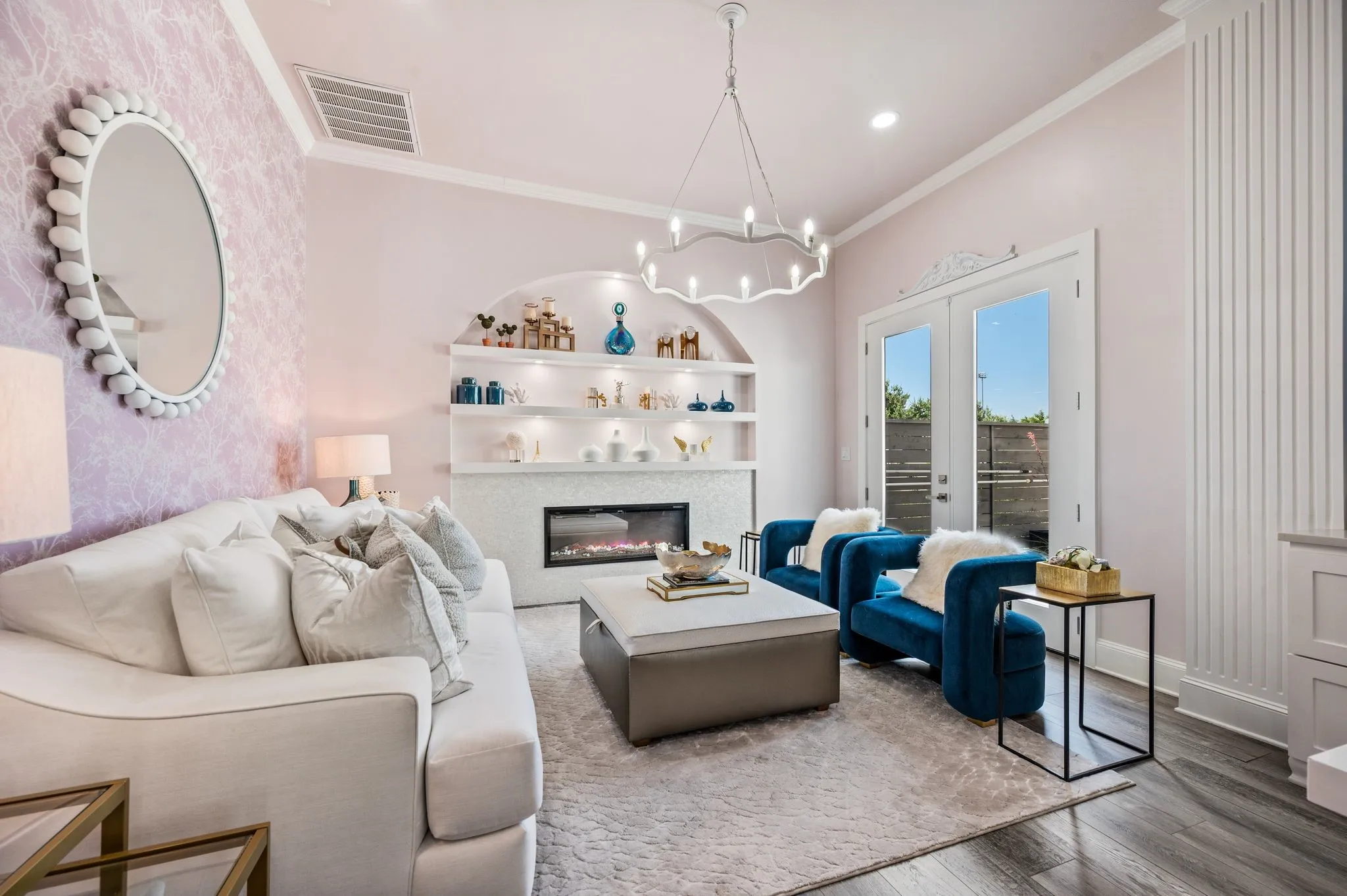 Office featuring a contemporary fireplace with an arched alcove and built-in shelving, French doors, wood-finish flooring, and crown molding