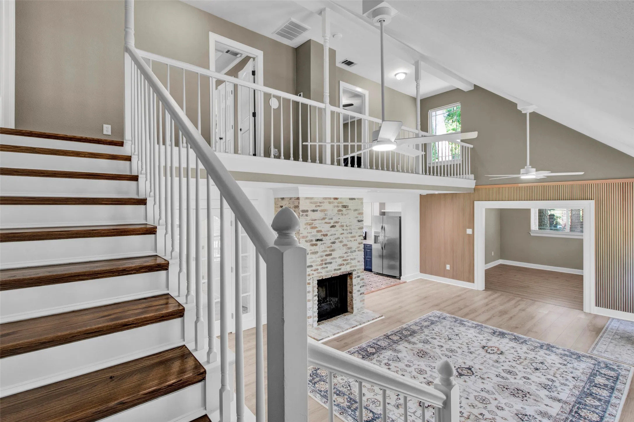 Two-tone staircase with wood-finish treads and white risers
