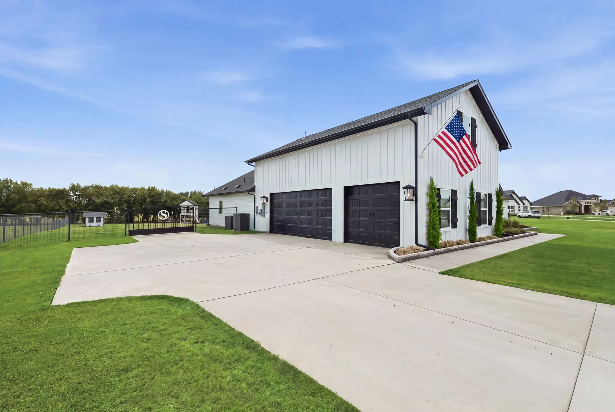 Large concrete driveway with multi door garage - Virtual Grass