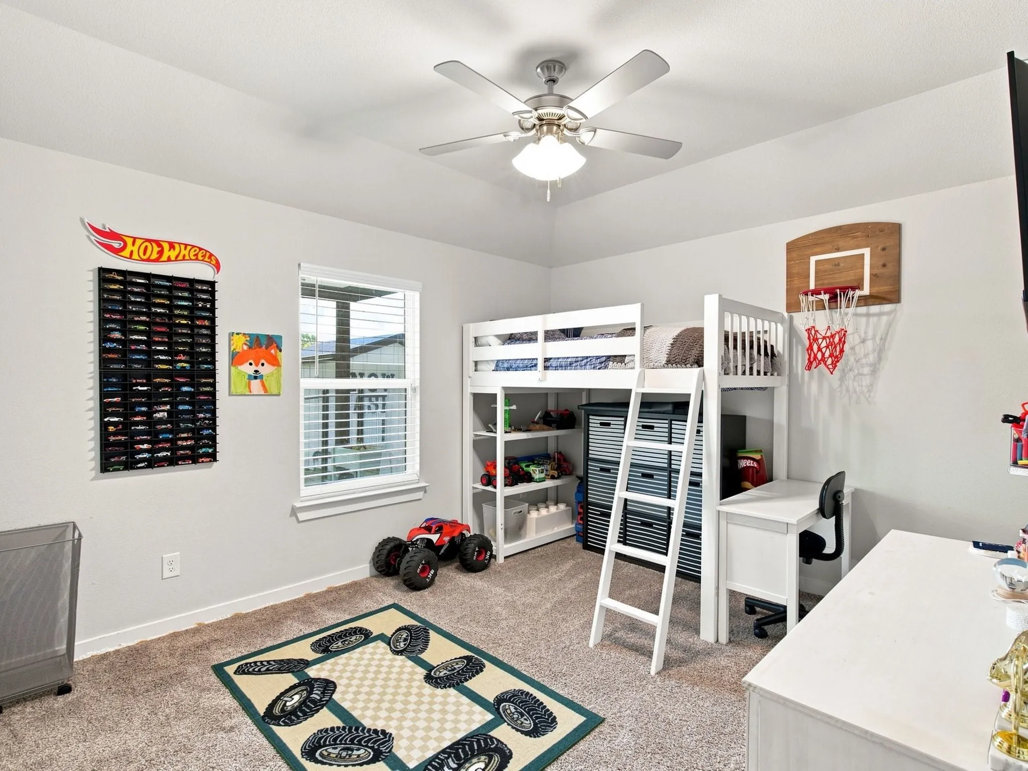 Recessed ceiling with a central fan light fixture, light gray walls, white window blinds, and neutral carpet flooring