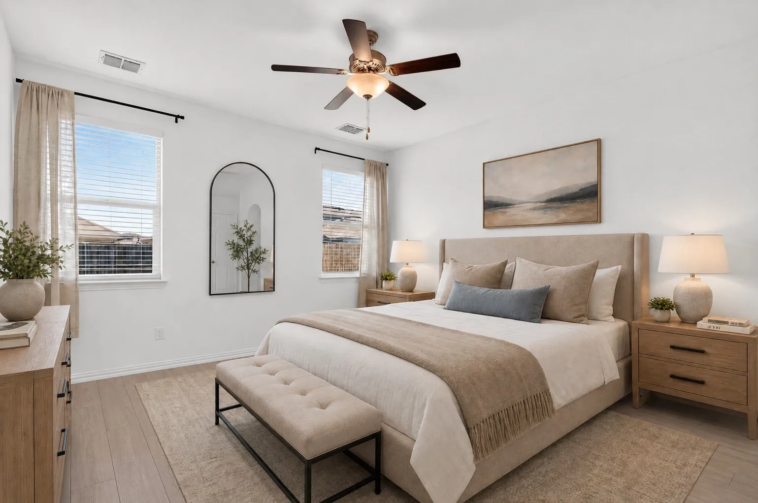 Wood-finish flooring, two windows with blinds, ceiling fan, and recessed lighting