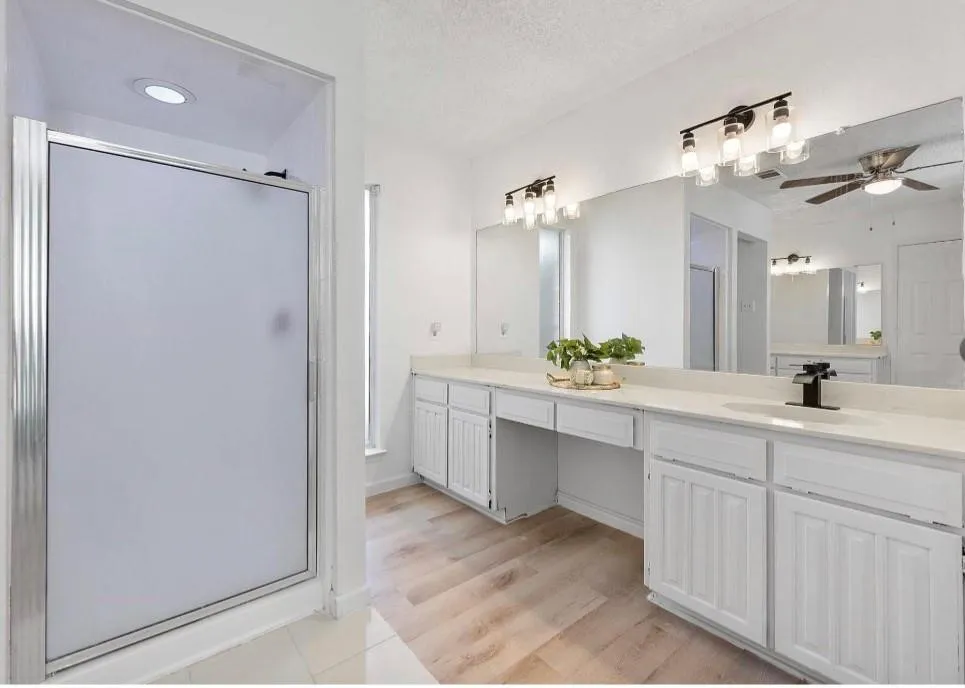 Frosted glass shower enclosure with recessed lighting