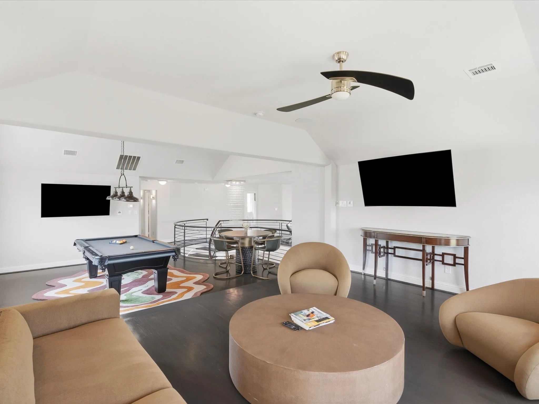 Dark wood-finish flooring with white walls