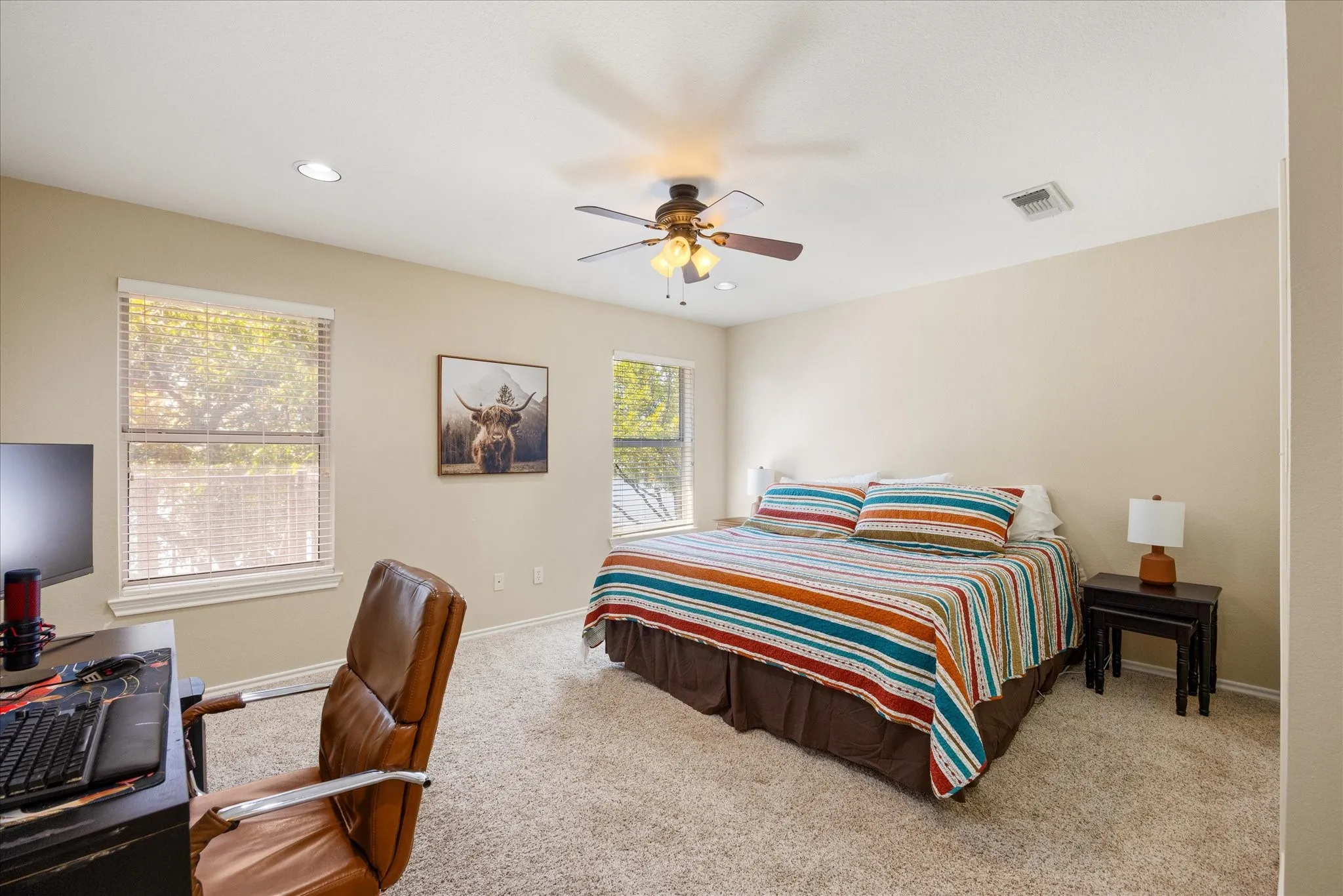 Spacious bedroom with ceiling fan, recessed lighting, and carpet flooring
