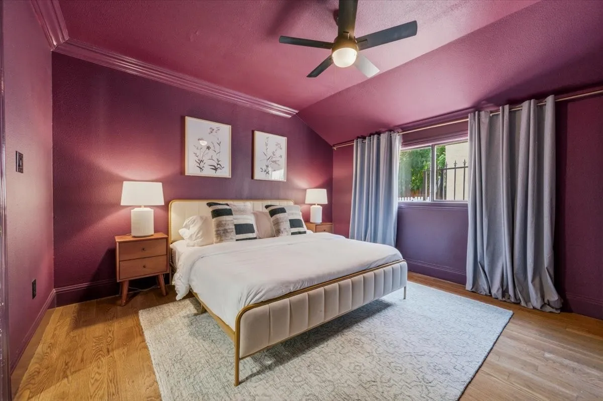 Hardwood-finish flooring, crown molding, and a ceiling fan with integrated lighting