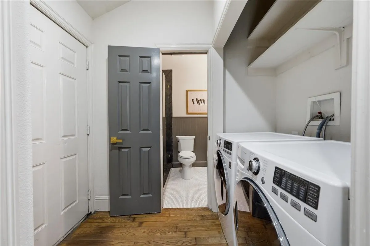 Wood-finish flooring, white paneled doors, and shelving