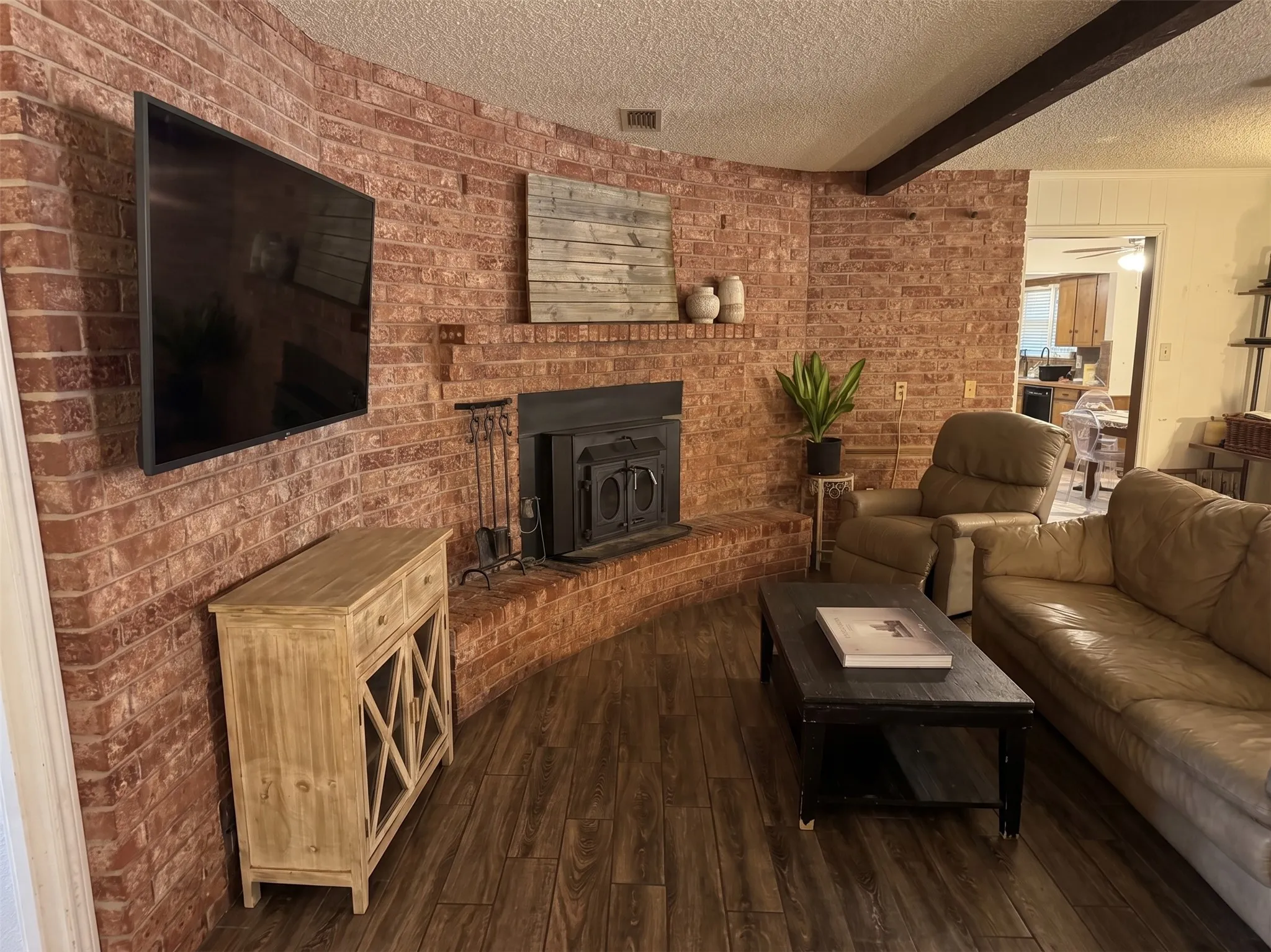 Living room with cozy wood burning fireplace
