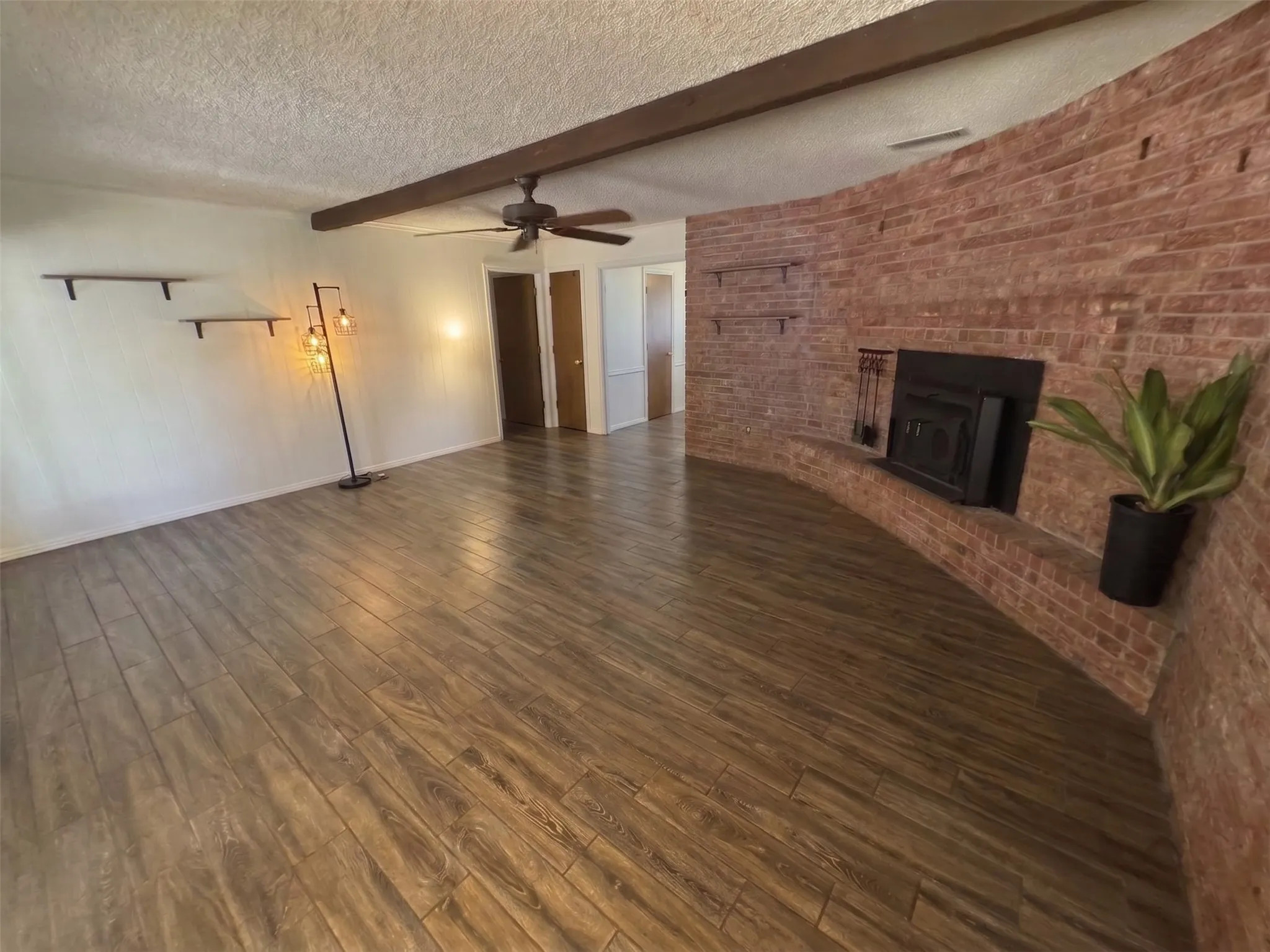 Living room virtually emptied to show room without firniture