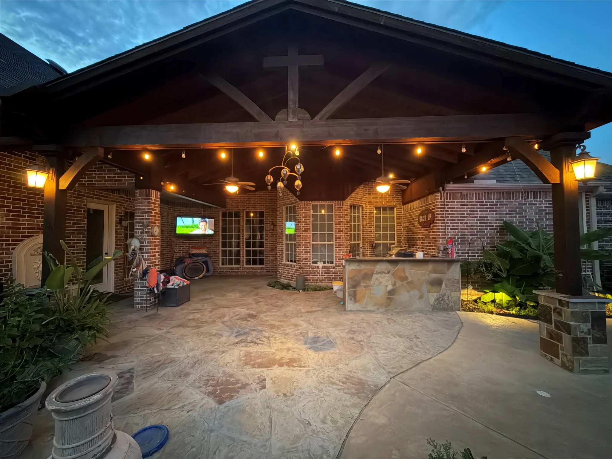 Large covered patio with outdoor kitchen