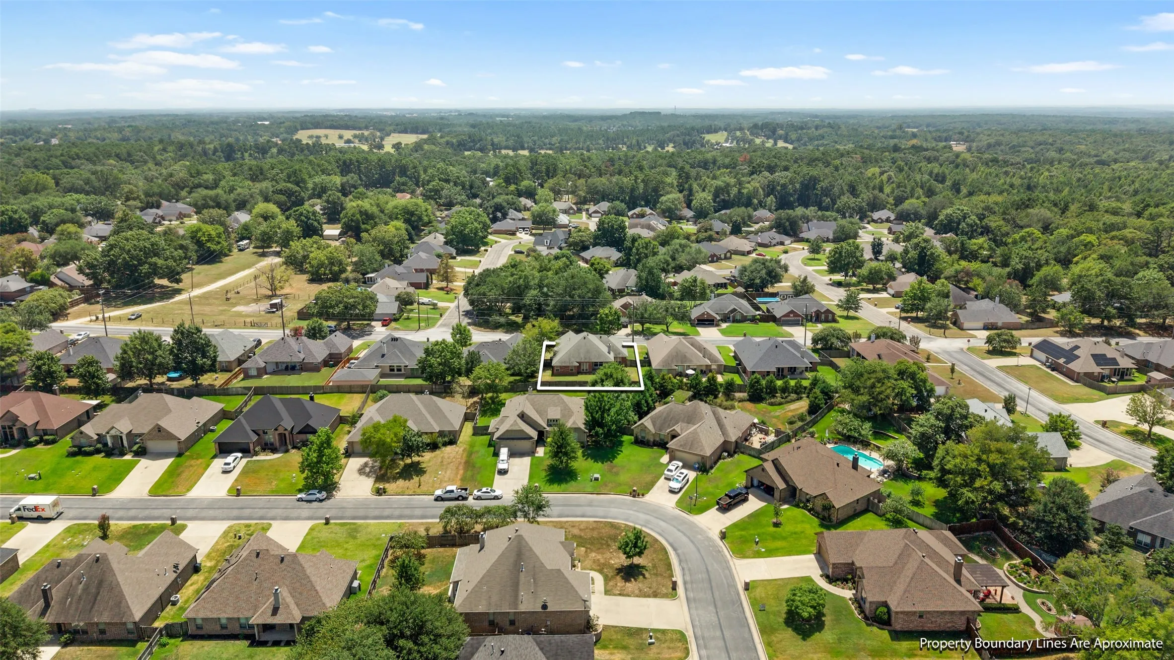 Established residential area with mature trees and a curvilinear street layout