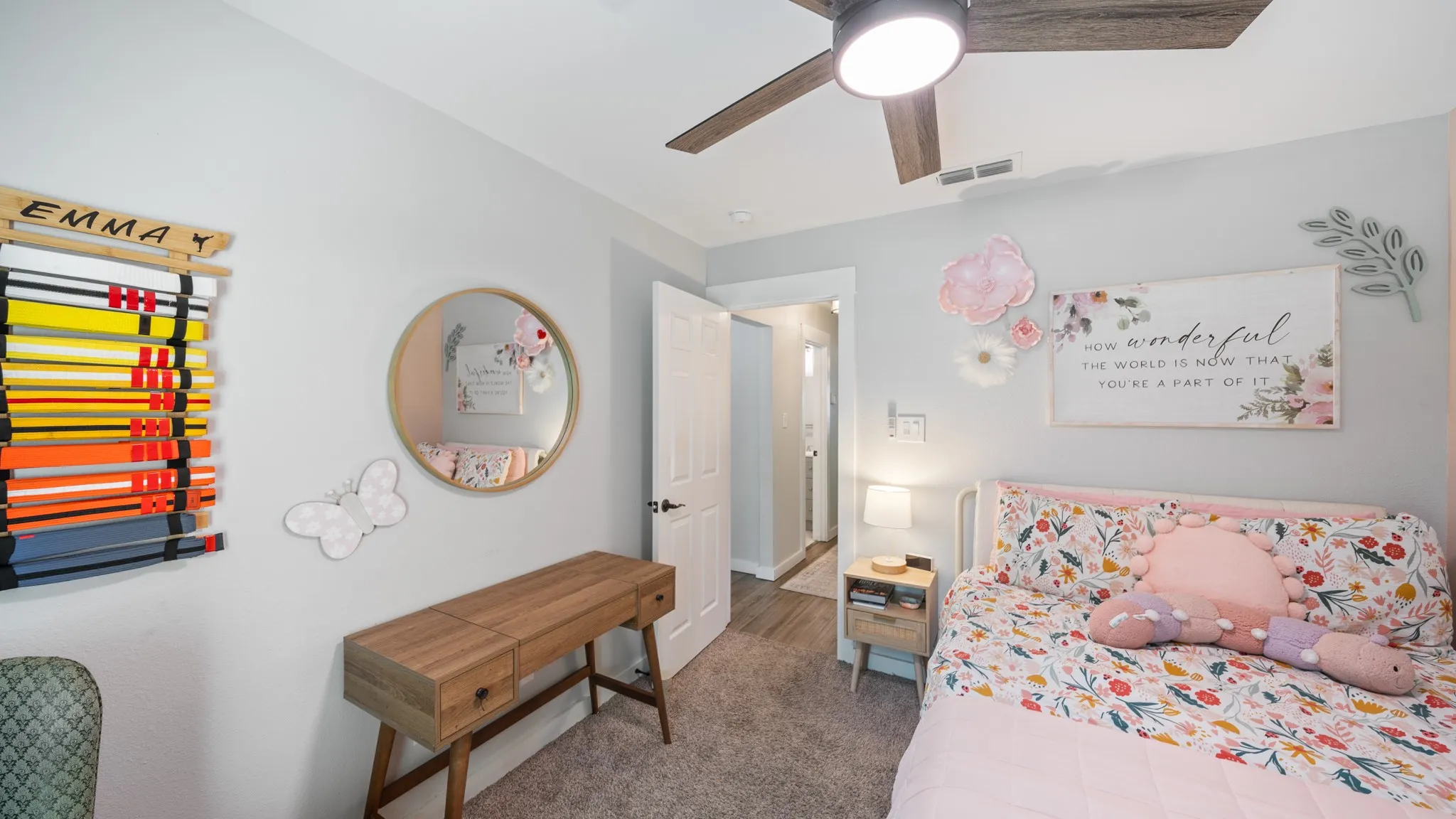 Recessed lighting, wood-finish ceiling fan, painted walls, carpeted flooring, and a white door frame