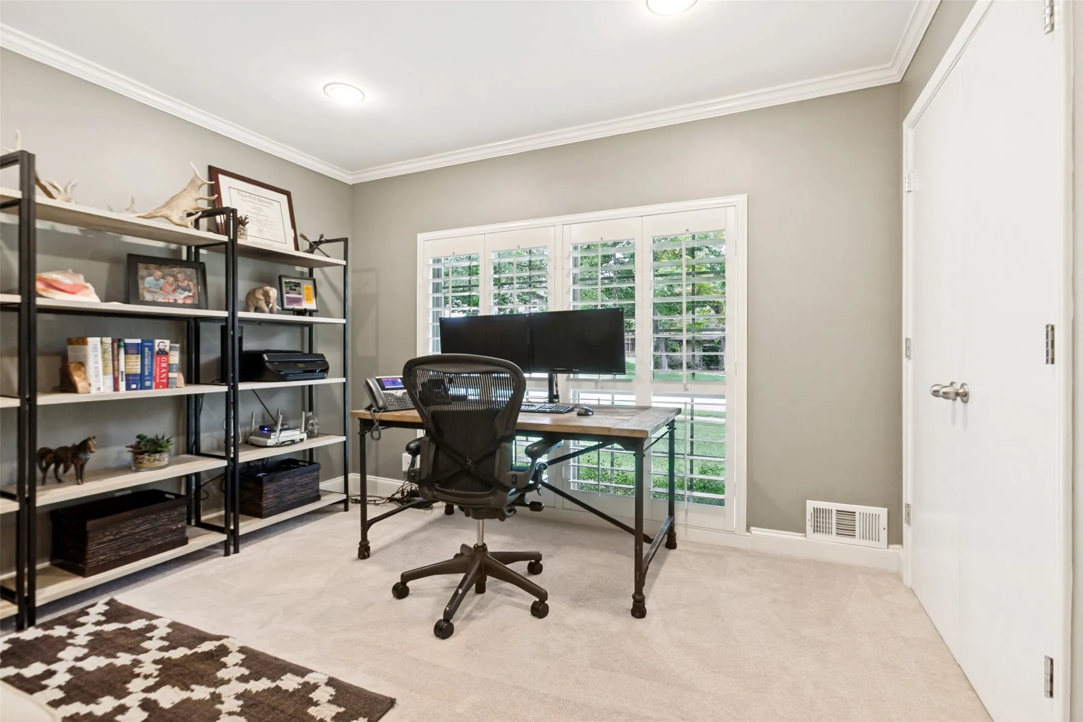 Bedroom #1 set as office with front yard view
