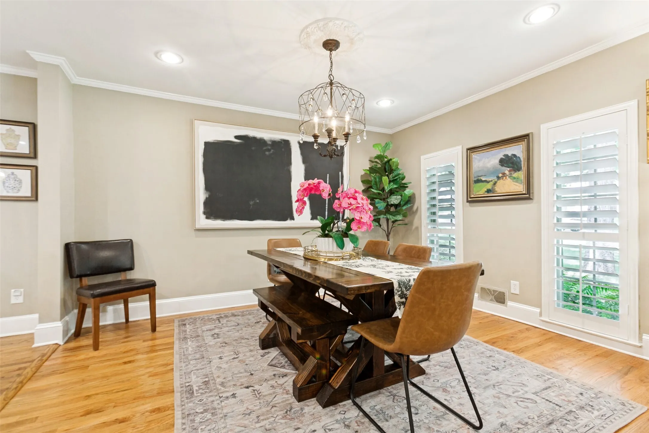 Dining area with recessed lighting and chandelier