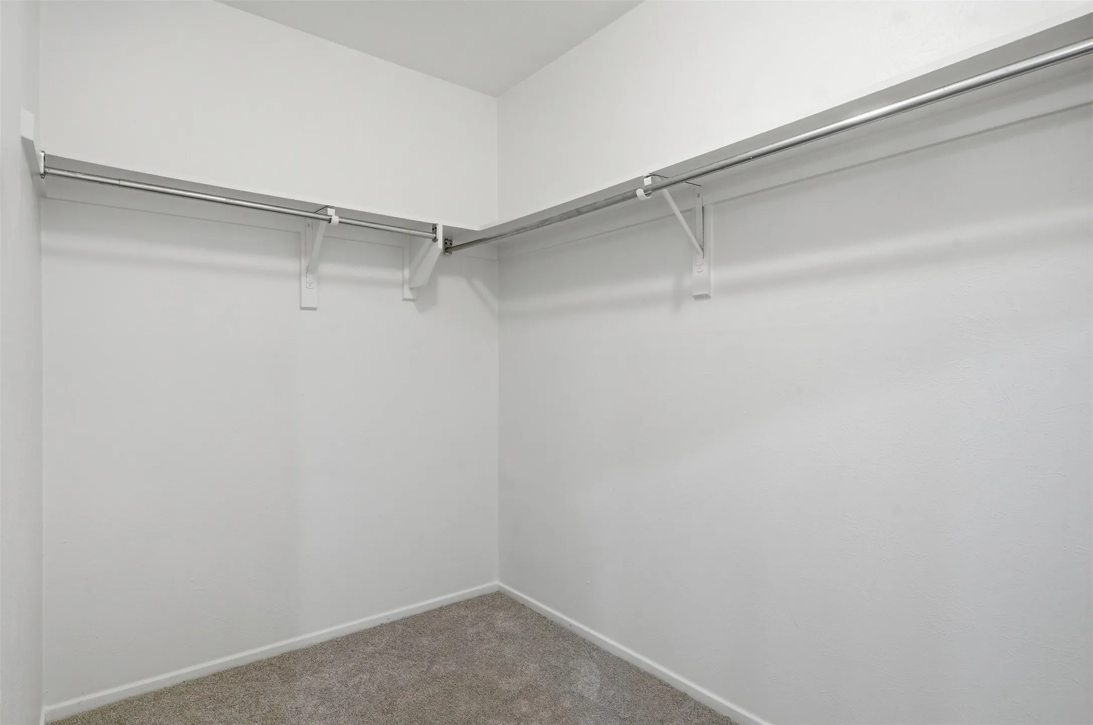 Large walk-in primary bedroom closet