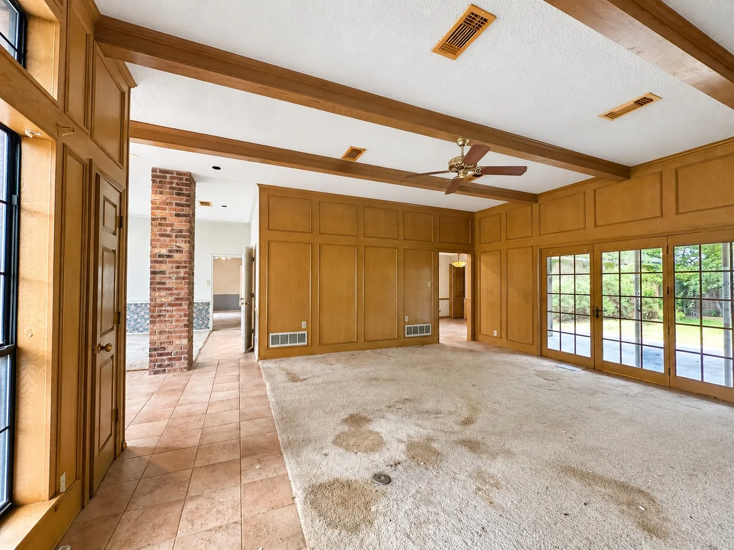 Wood-paneled walls and ceiling beams