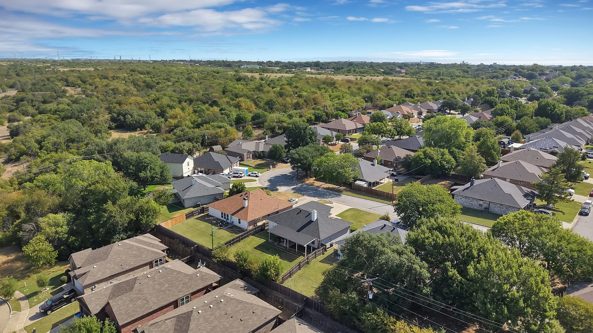 Residential properties with varied rooflines and established landscaping