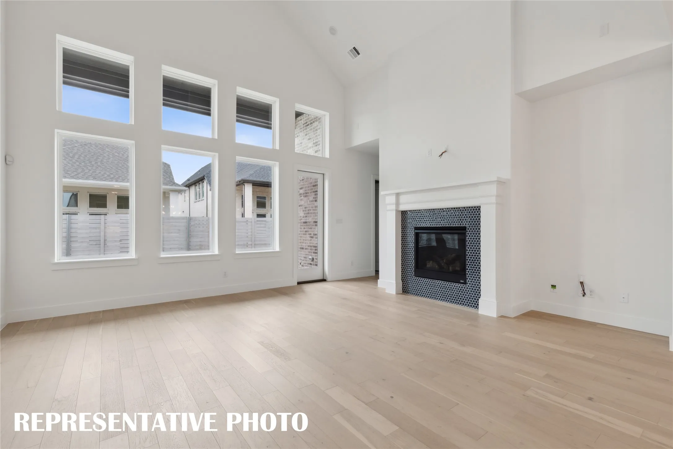 The entire family will love family get togethers in this lovely, light filled living room.  REPRESENTATIVE PHOTO