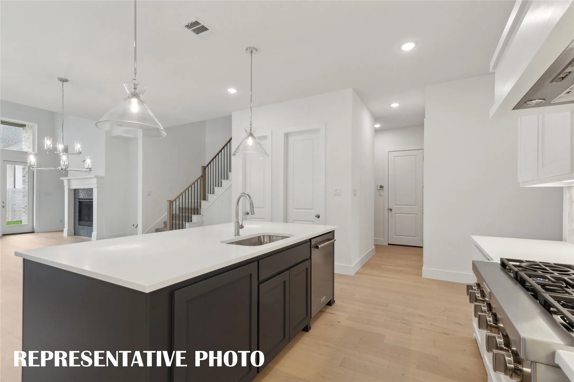 Featuring a perfectly designed open concept floor plan, the chef will never be left out of the party in our Justin floor plan!  REPRESENTATIVE PHOTO