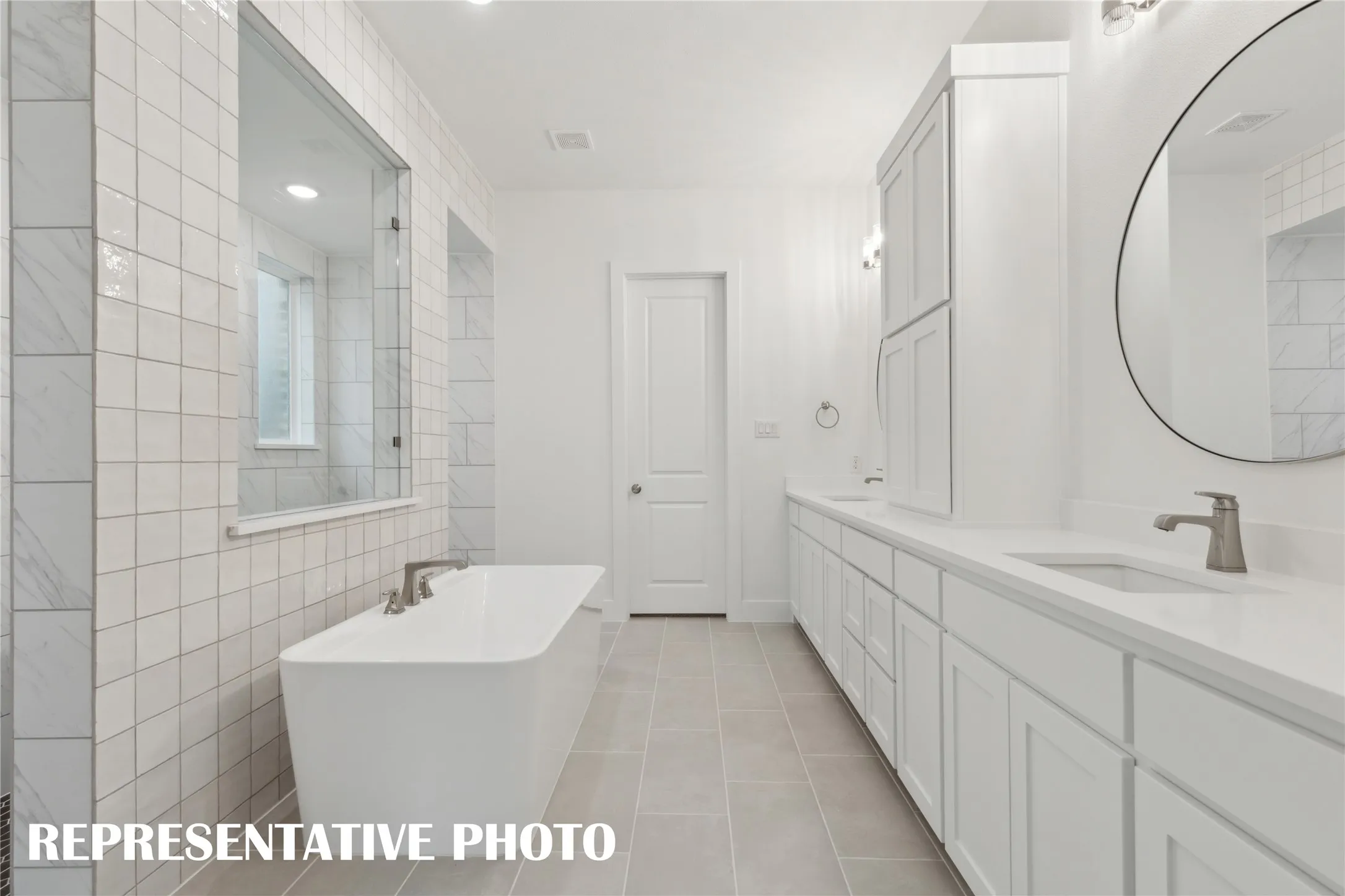 You'll find ample room for two in this gorgeous owner's bath!  REPRESENTATIVE PHOTO