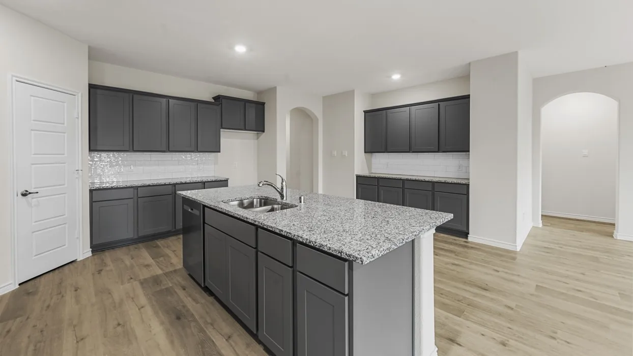 Wood-finish flooring throughout, complemented by dark gray cabinetry