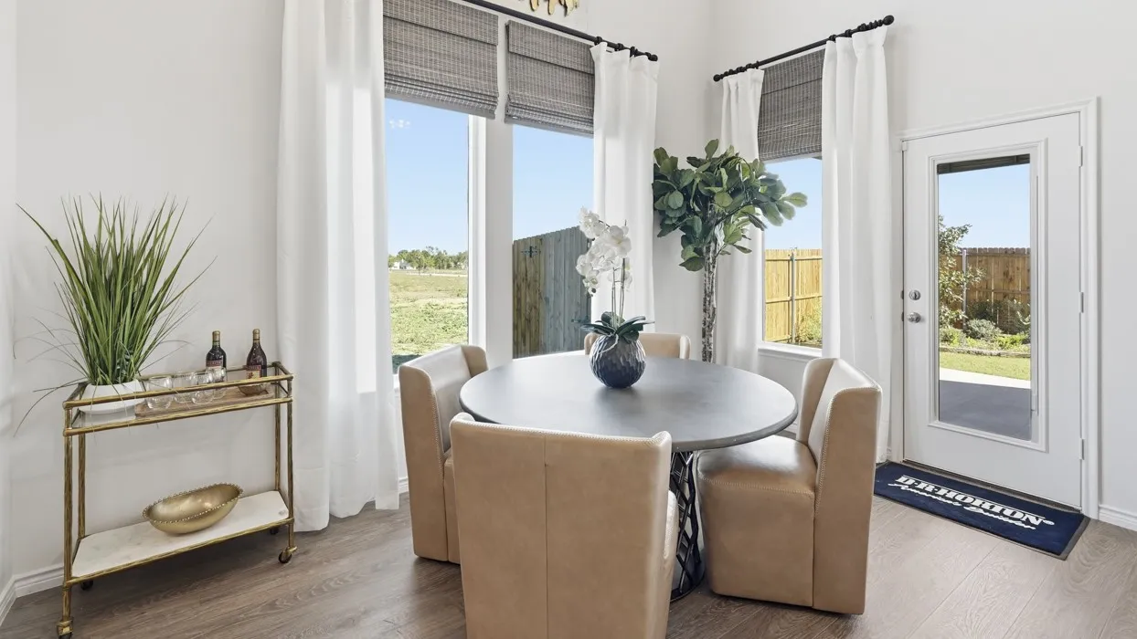 Wood-finish flooring, white walls, and a full-light exterior door