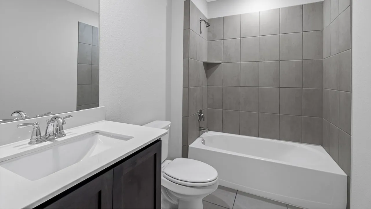 White solid surface countertop with an integrated sink and chrome faucet