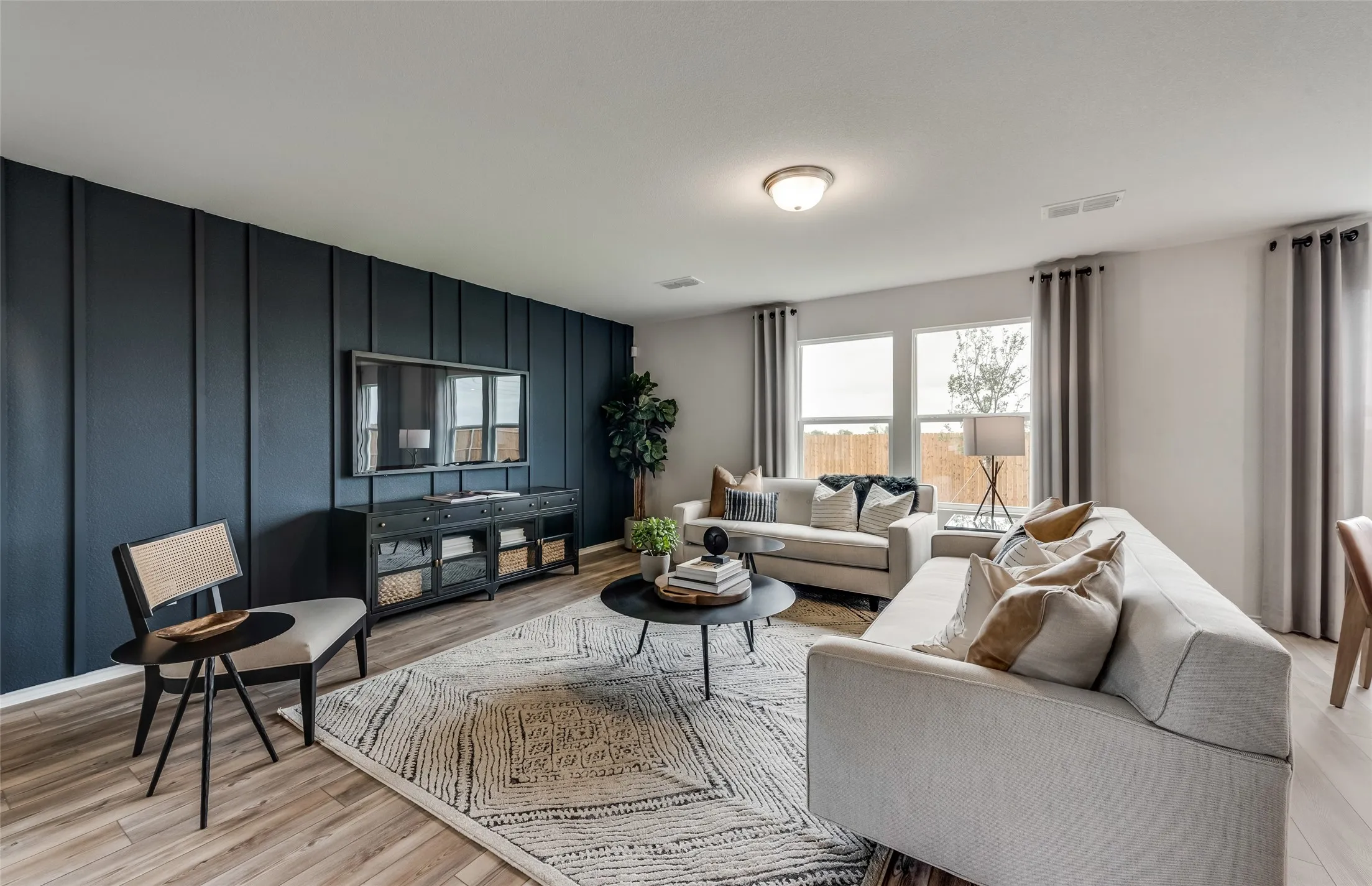 *Model Representation - Spacious gathering room with large windows