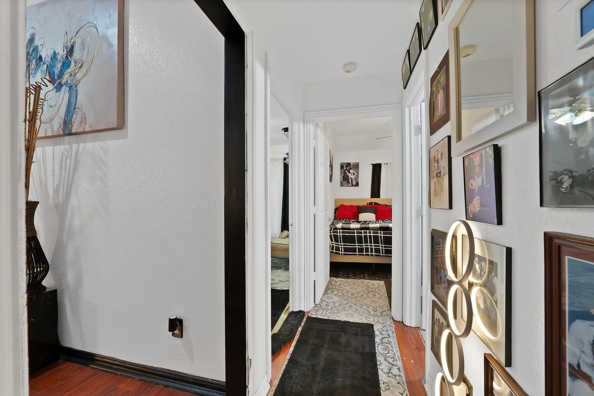 Hardwood-style flooring and white painted walls