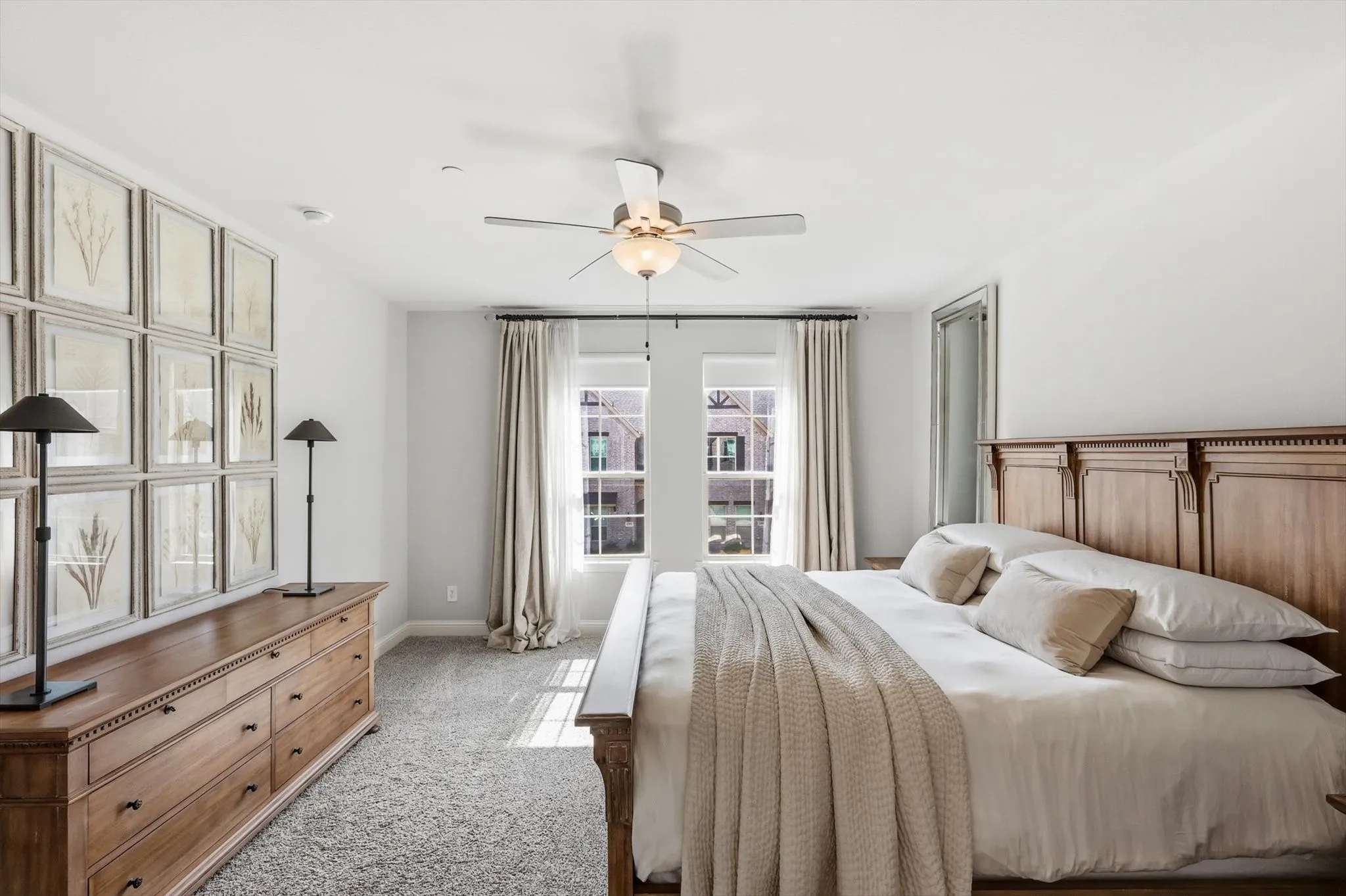 Spacious primary bedroom with two walk-in closets and lots ample natural light.
