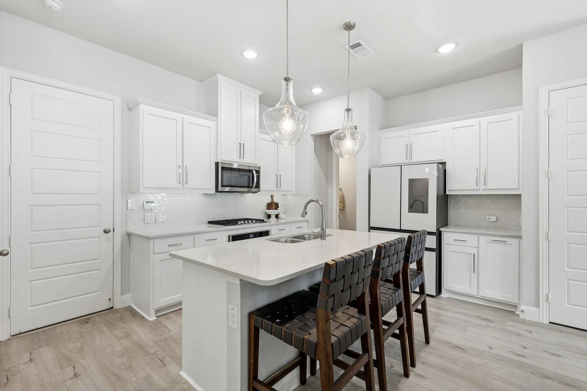 Spacious kitchen with island, smart fridge, an oven that has barely been used and a great coffee/tea nook.